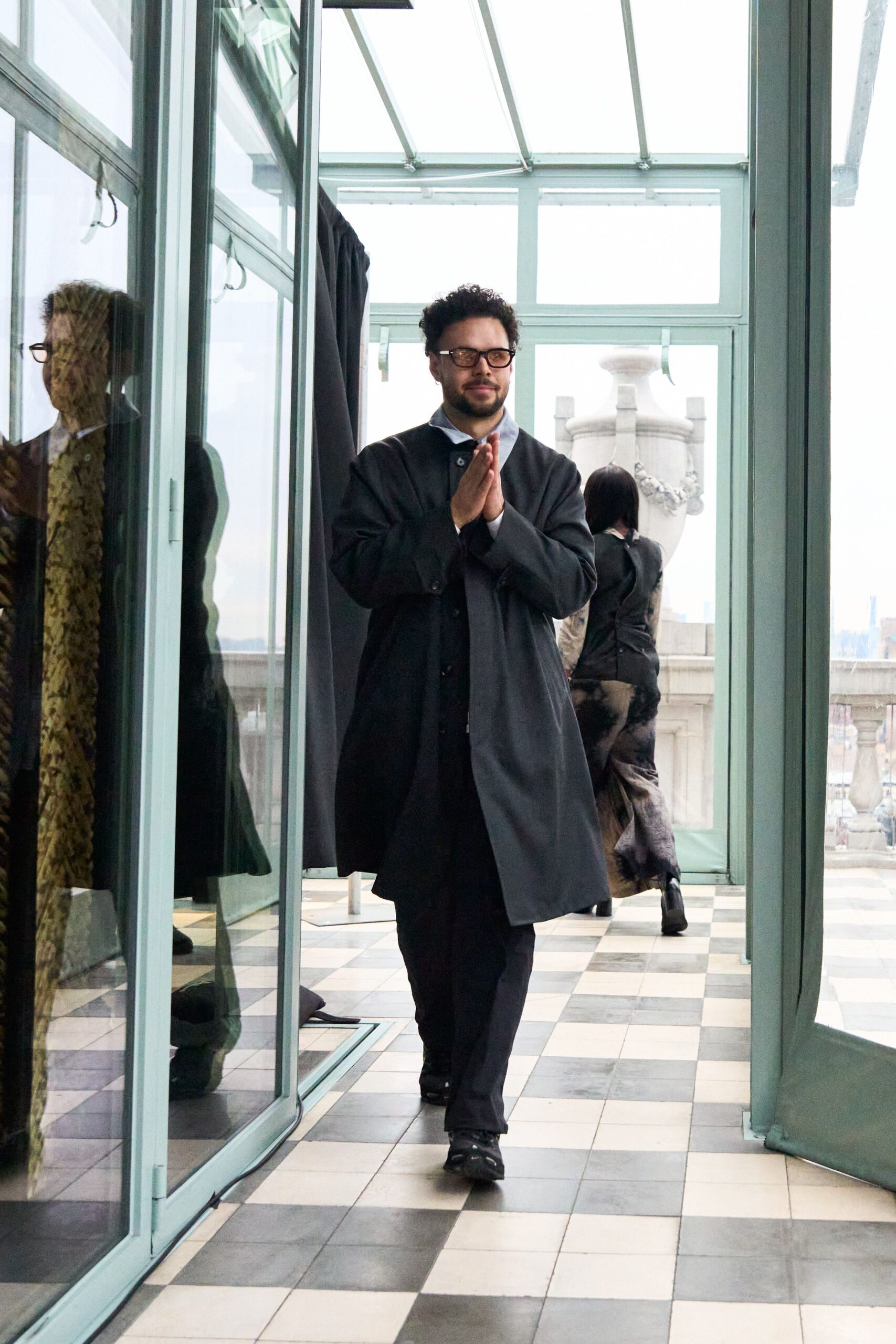 black wool coat with tailored pants