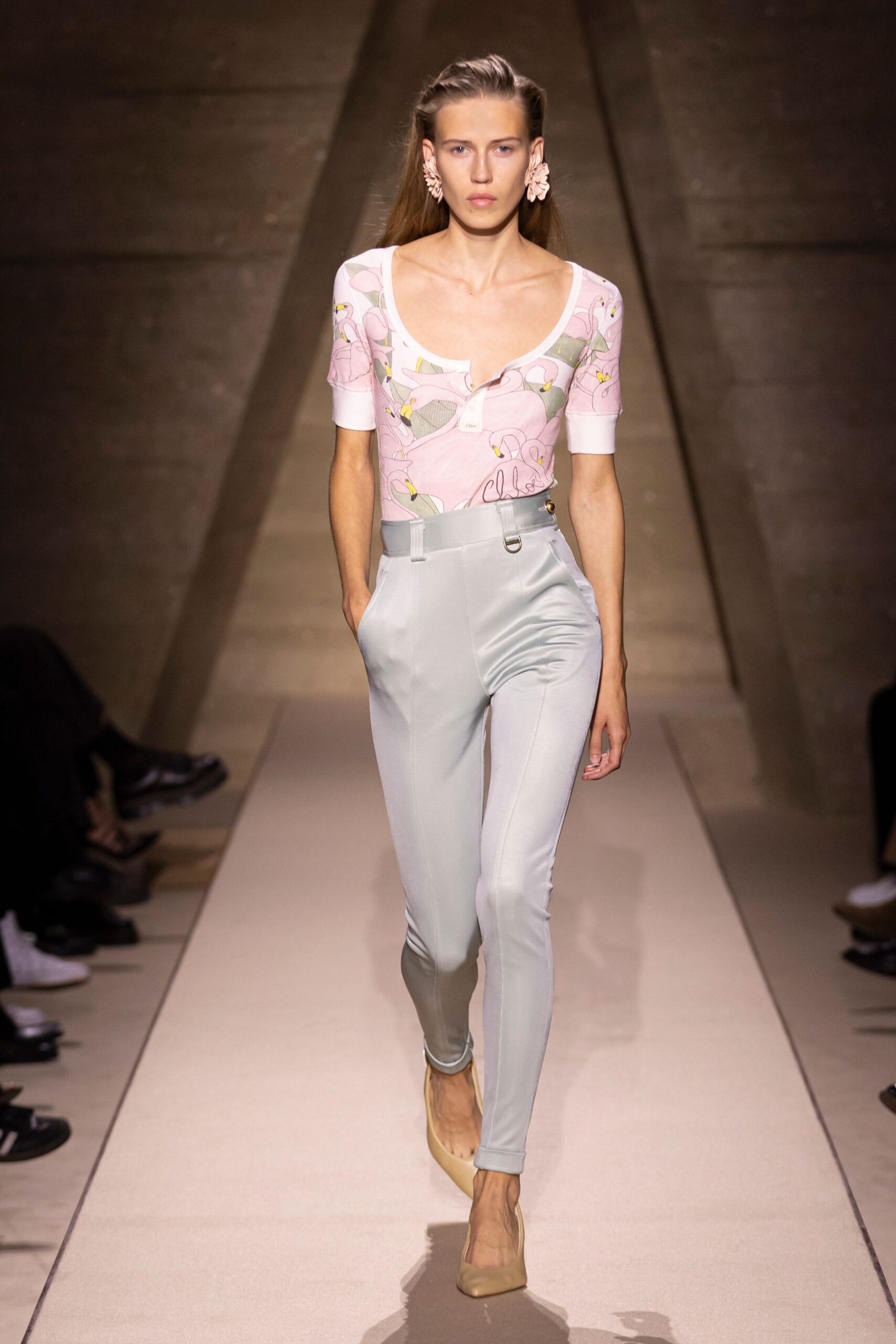 pink embroidered top with light blue pants
