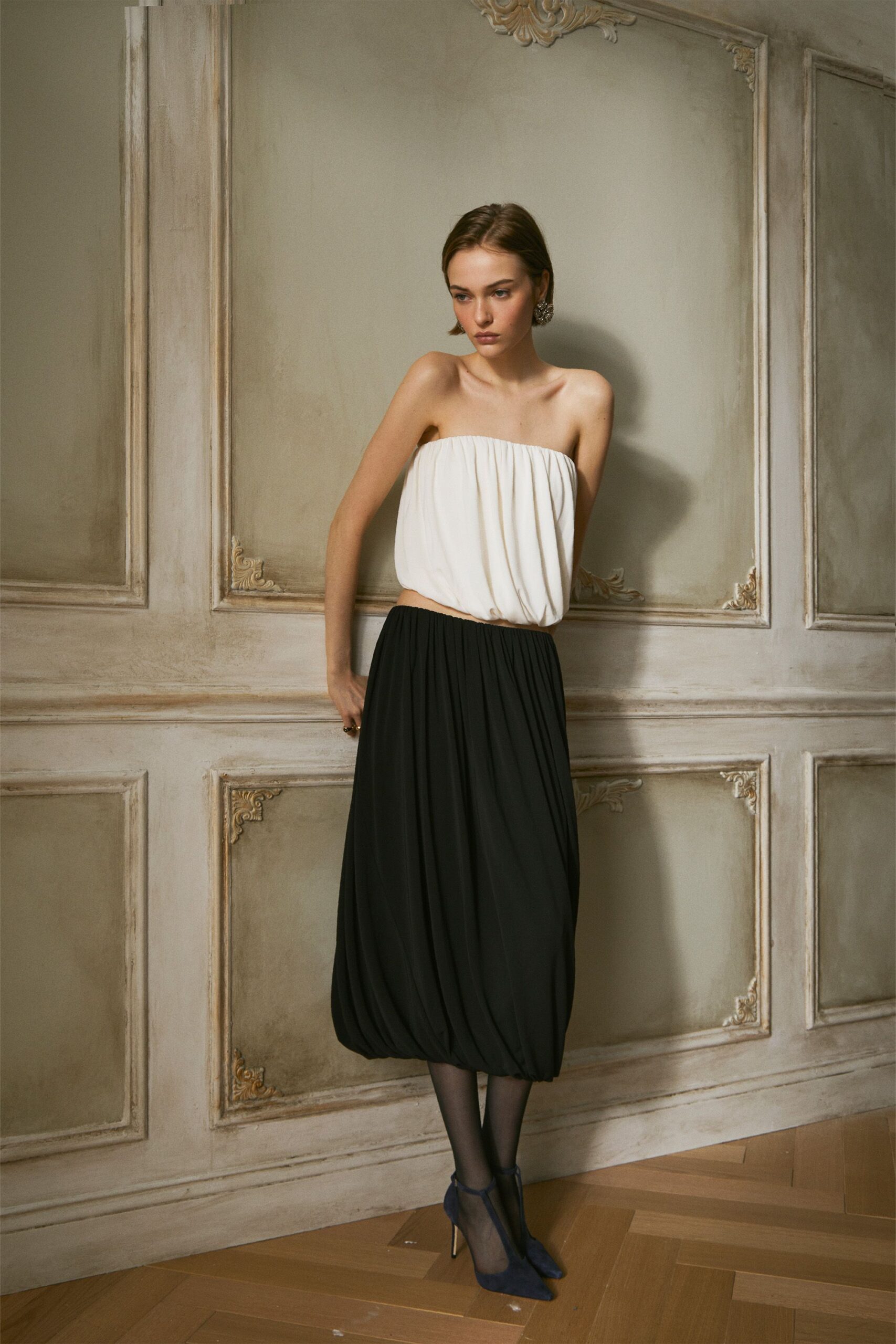 white silk sleeveless strapless fitted draped top