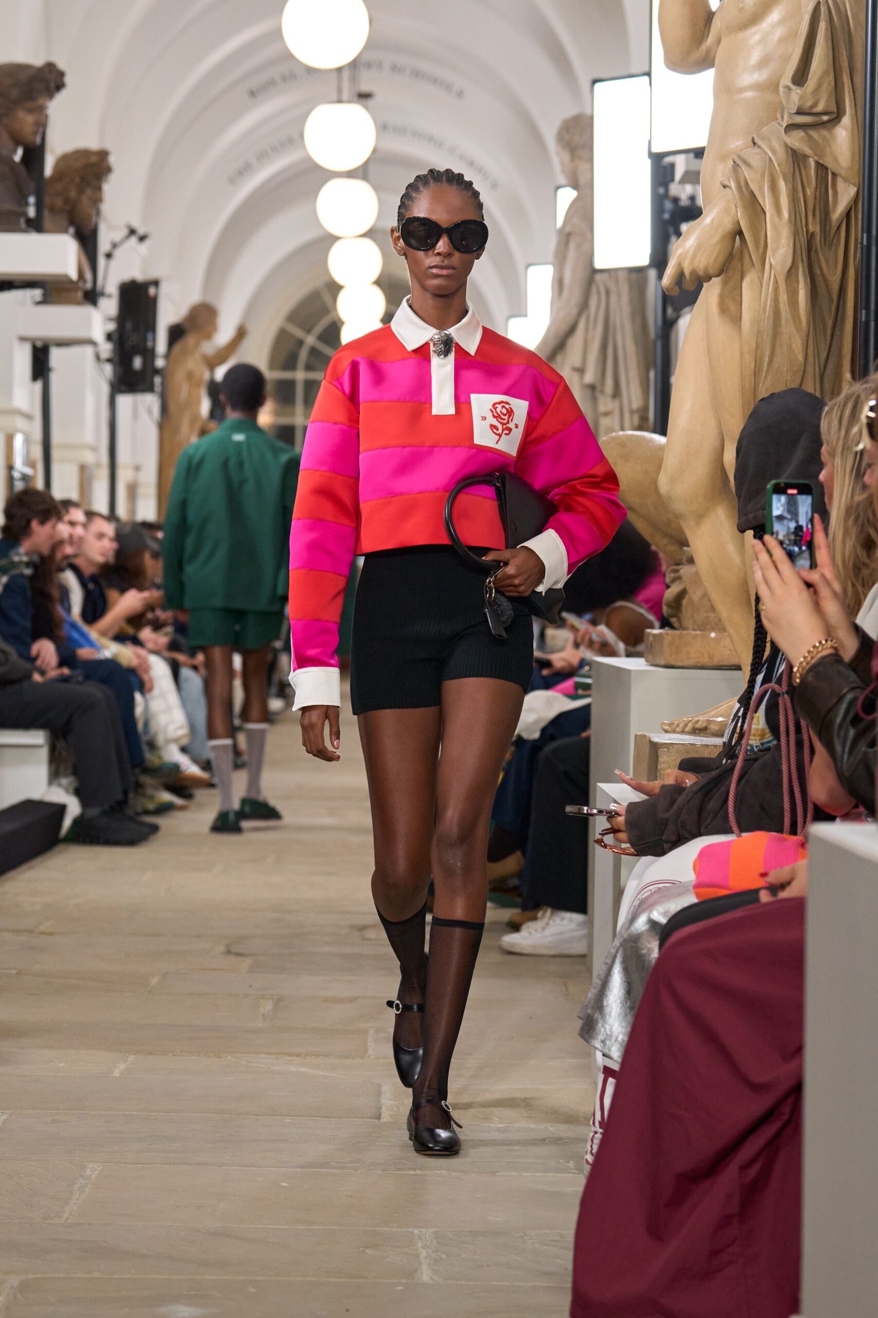 pink and white color-blocked top with black shorts