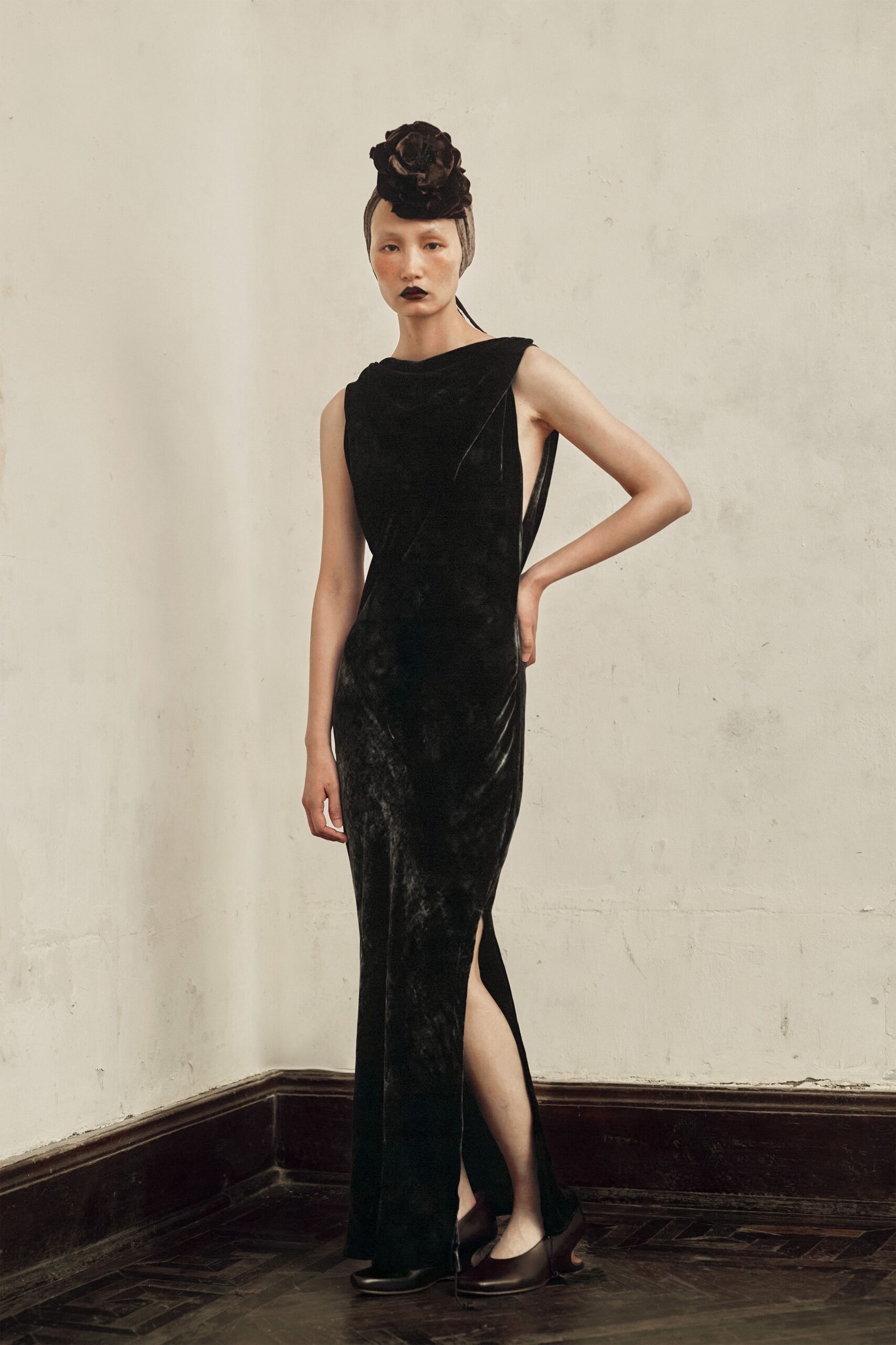 black velvet sleeveless high-neck fitted flowing maxi gown