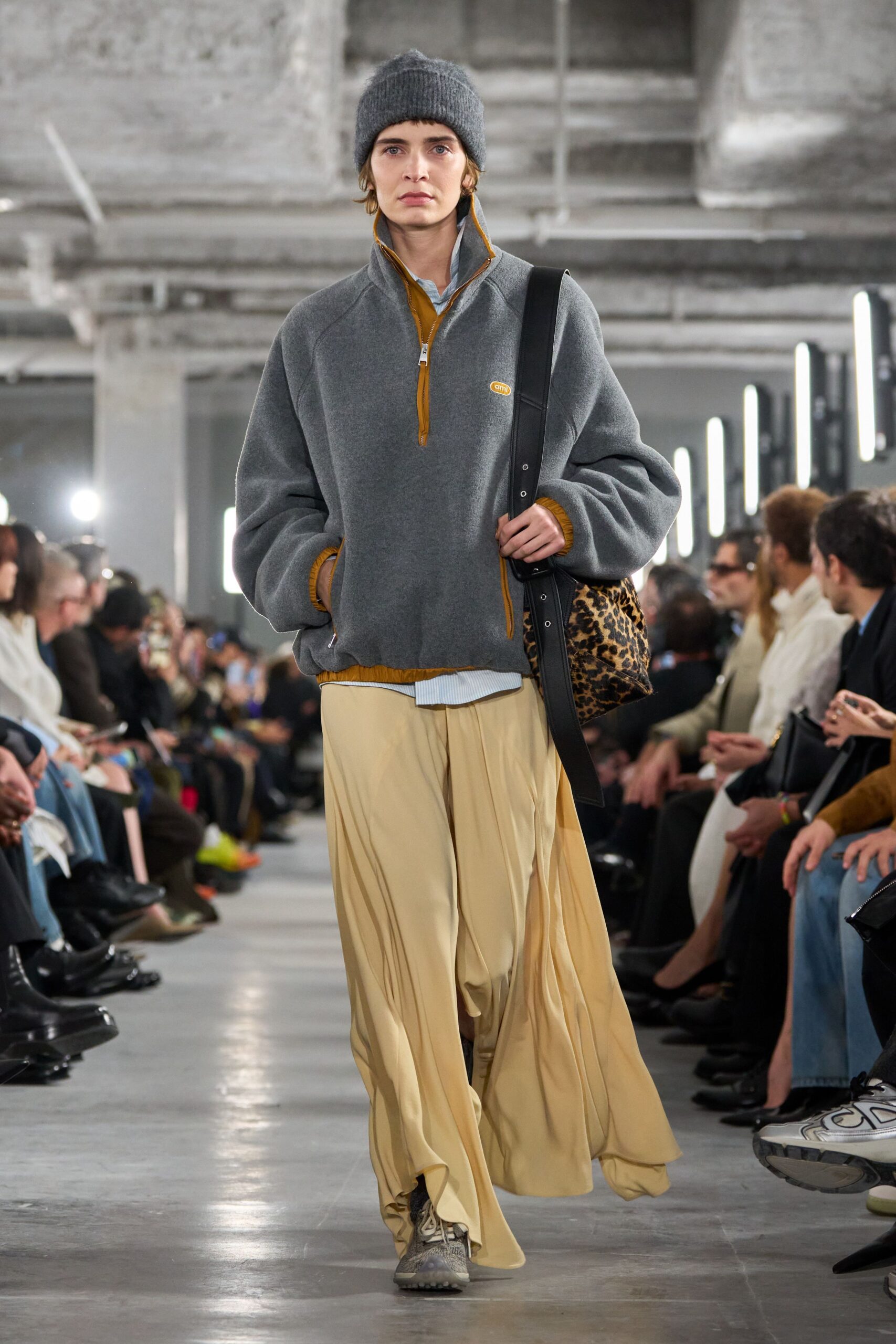 gray relaxed sweater with beige skirt