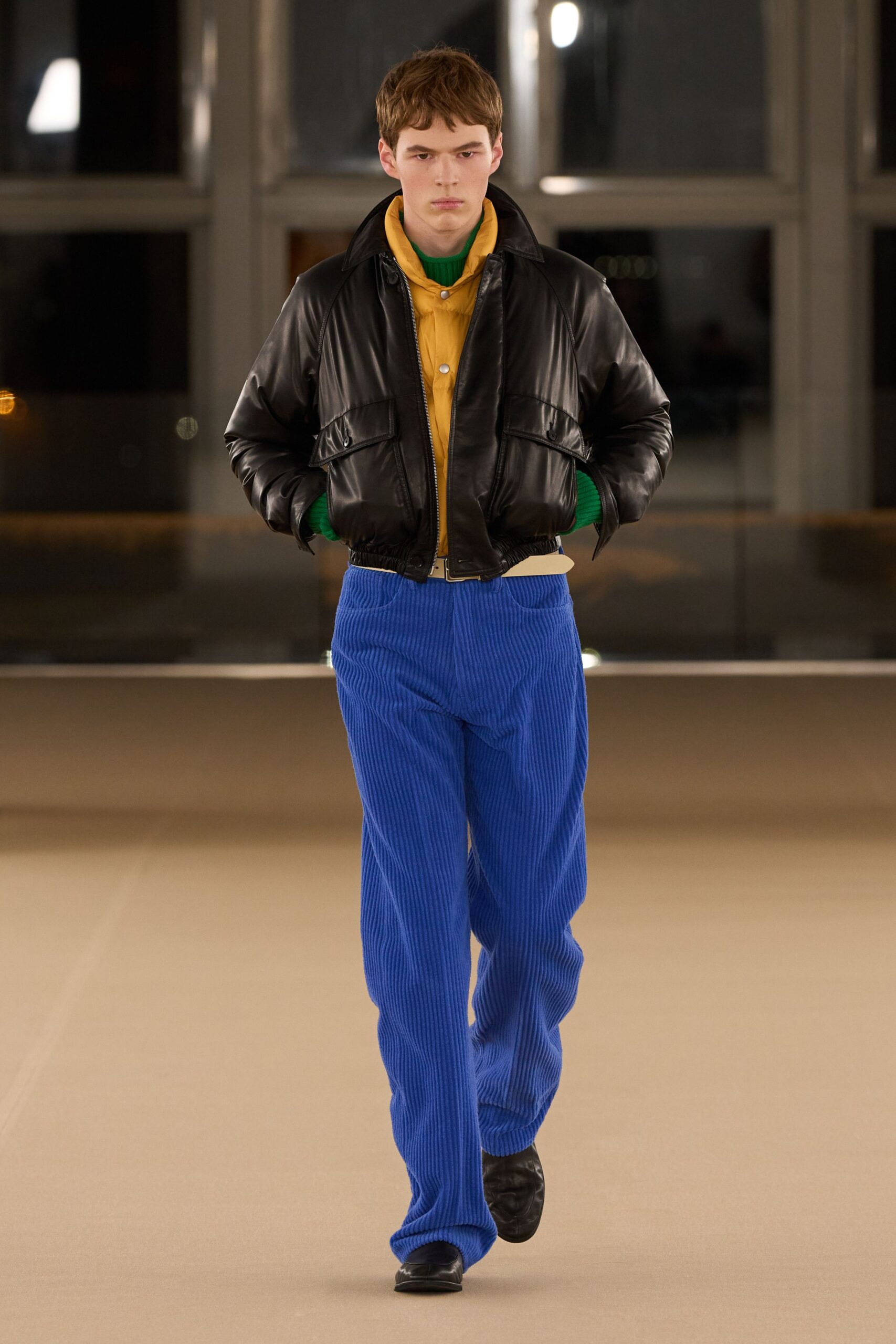 black leather jacket yellow shirt blue pants