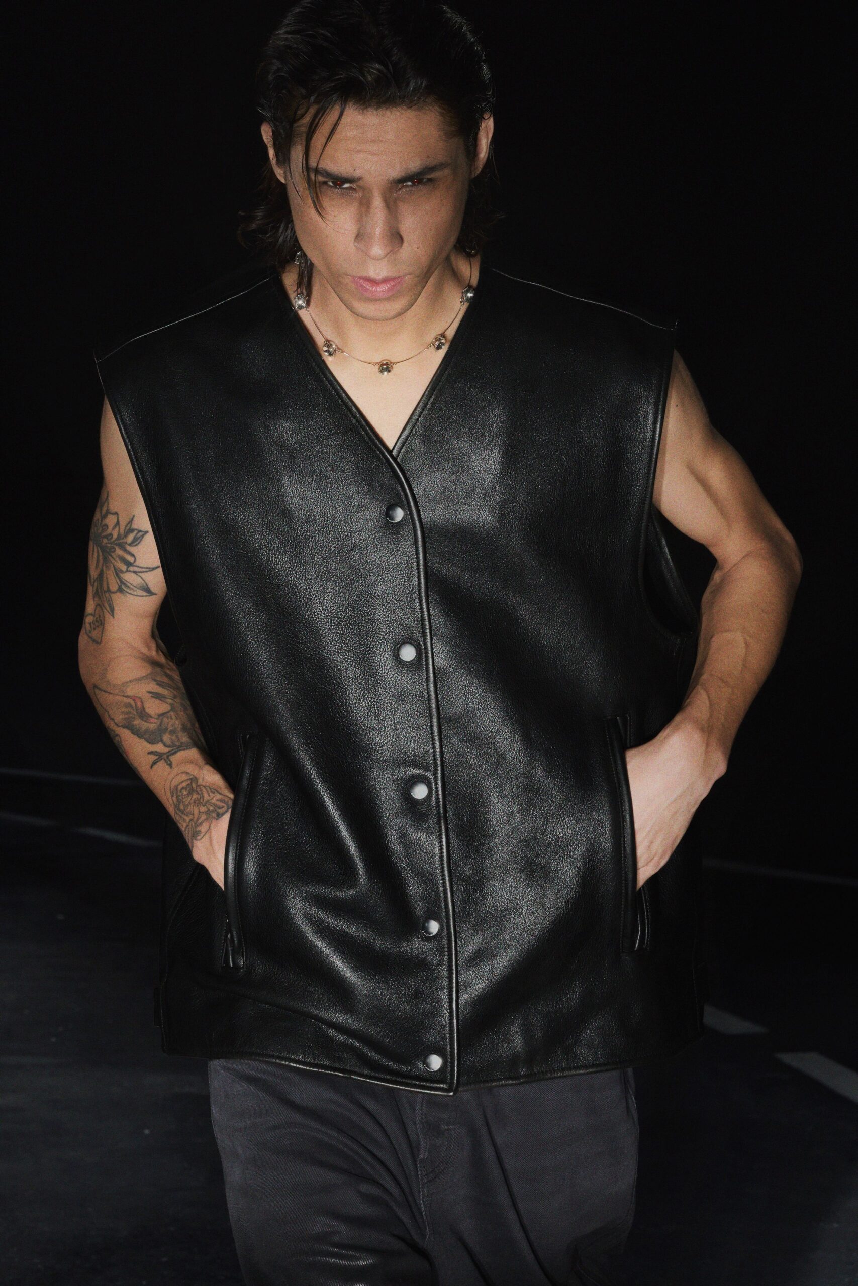 black leather sleeveless collared fitted buttoned pockets vest