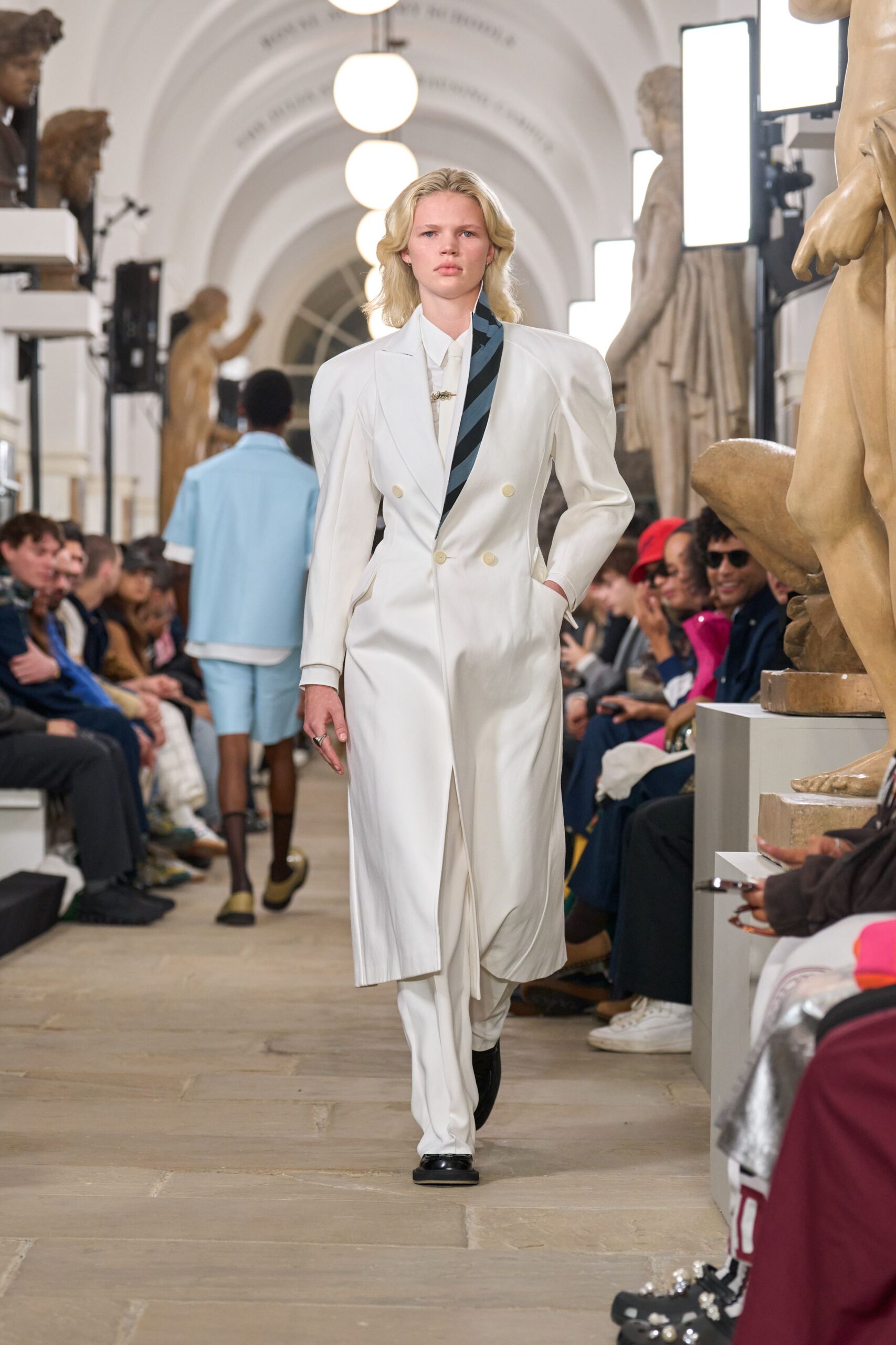 white tailored suit with black shoes