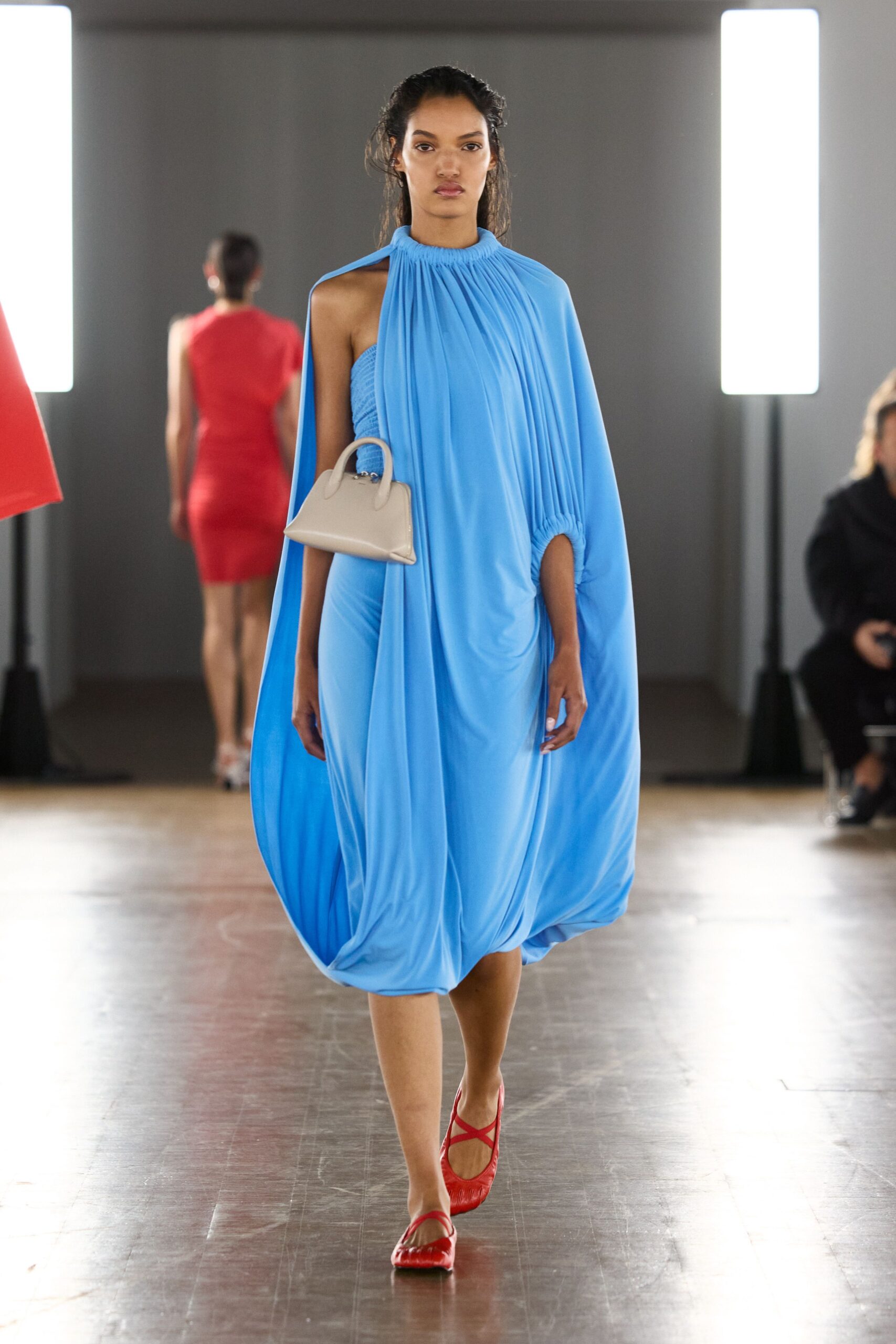 blue draped midi dress with red shoes