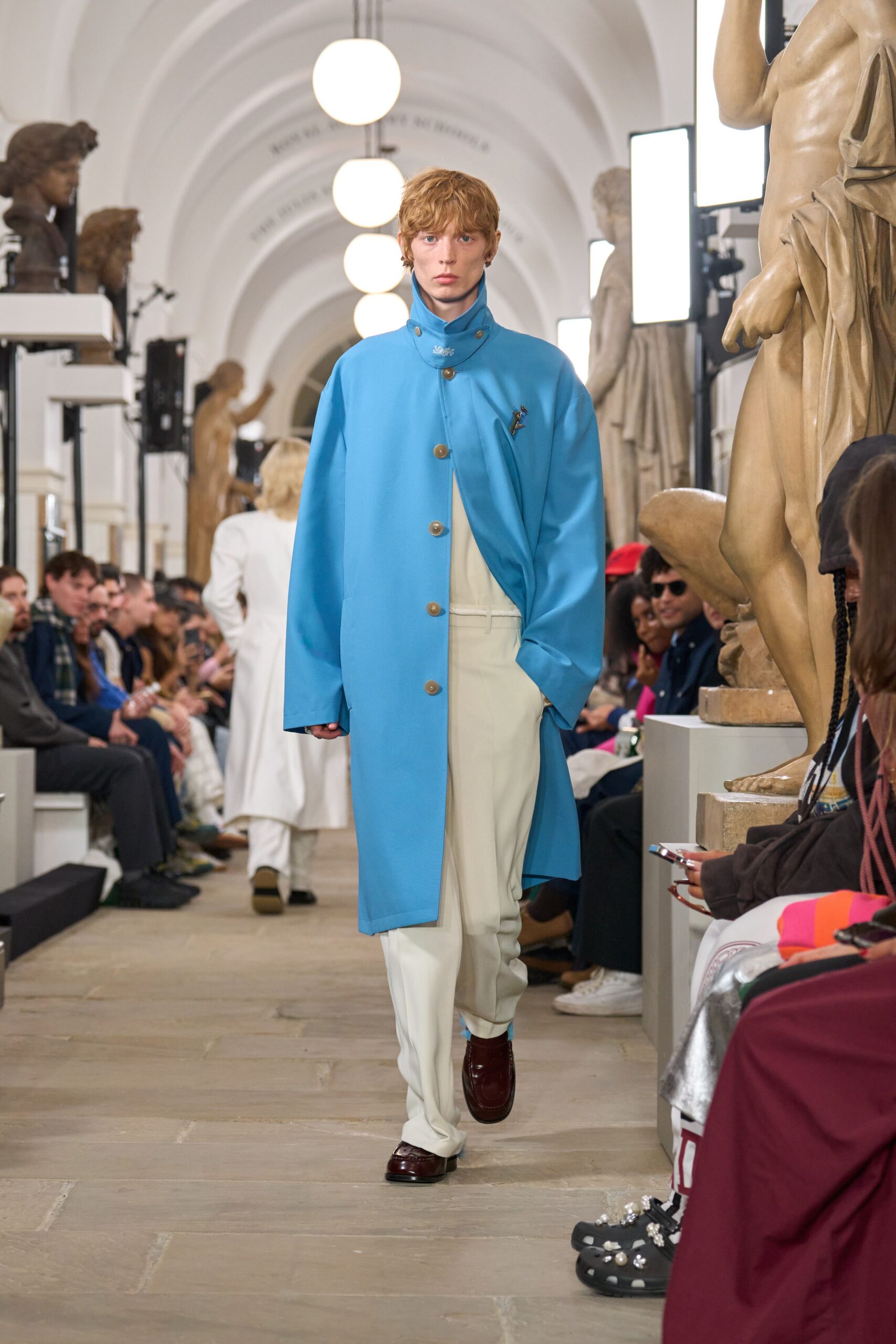 blue coat white pants brown shoes