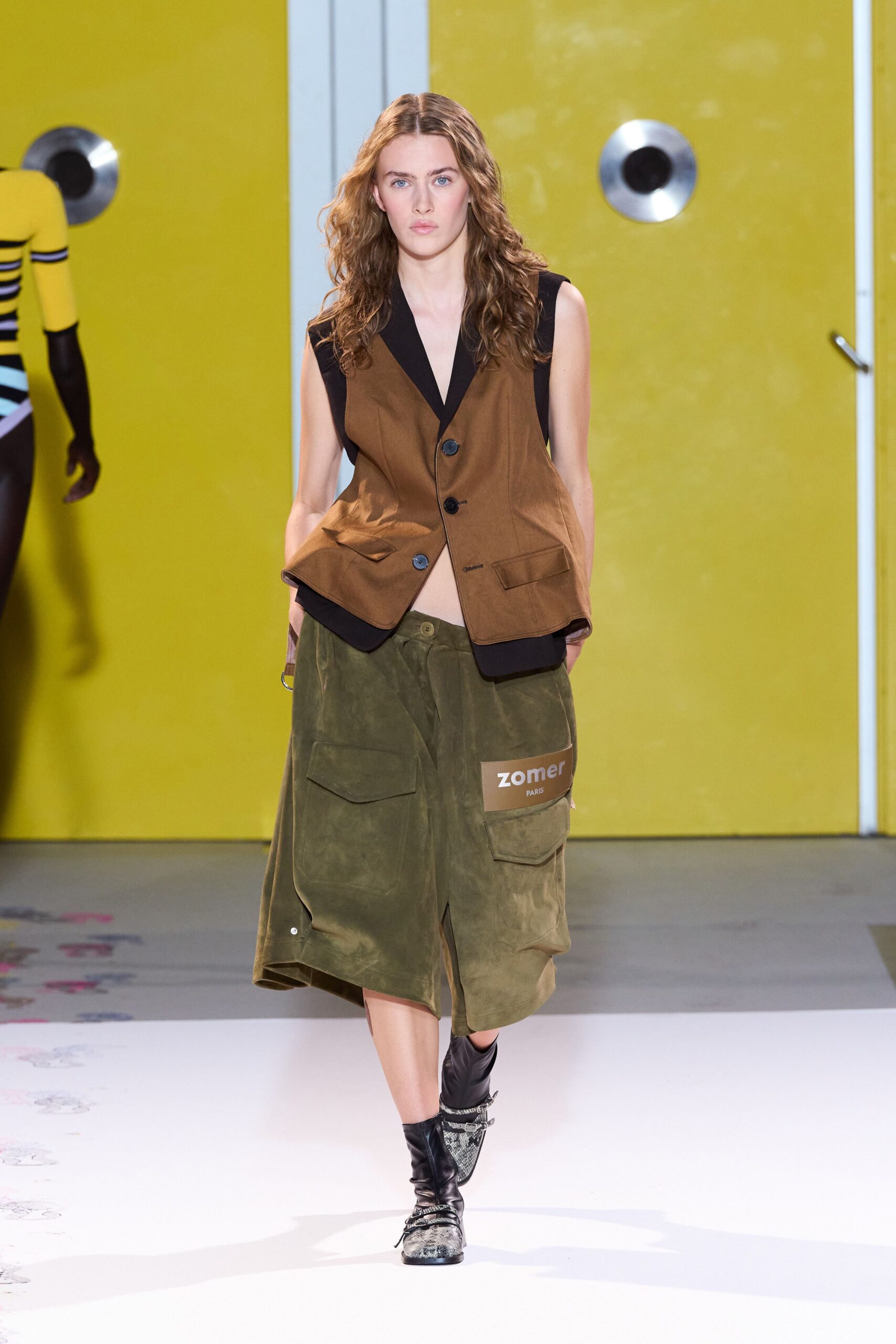 brown vest green skirt black boots