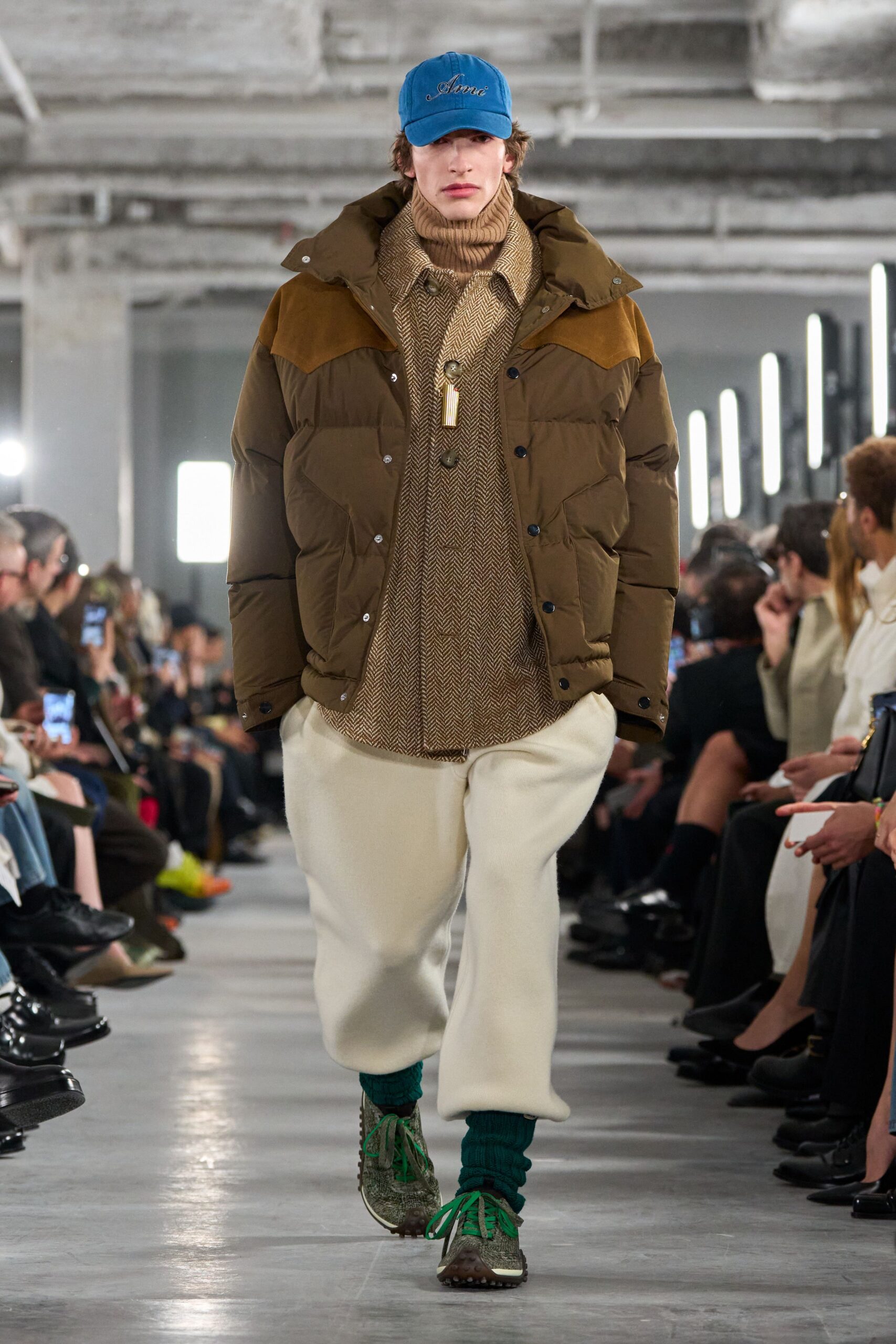 brown jacket beige sweater white pants