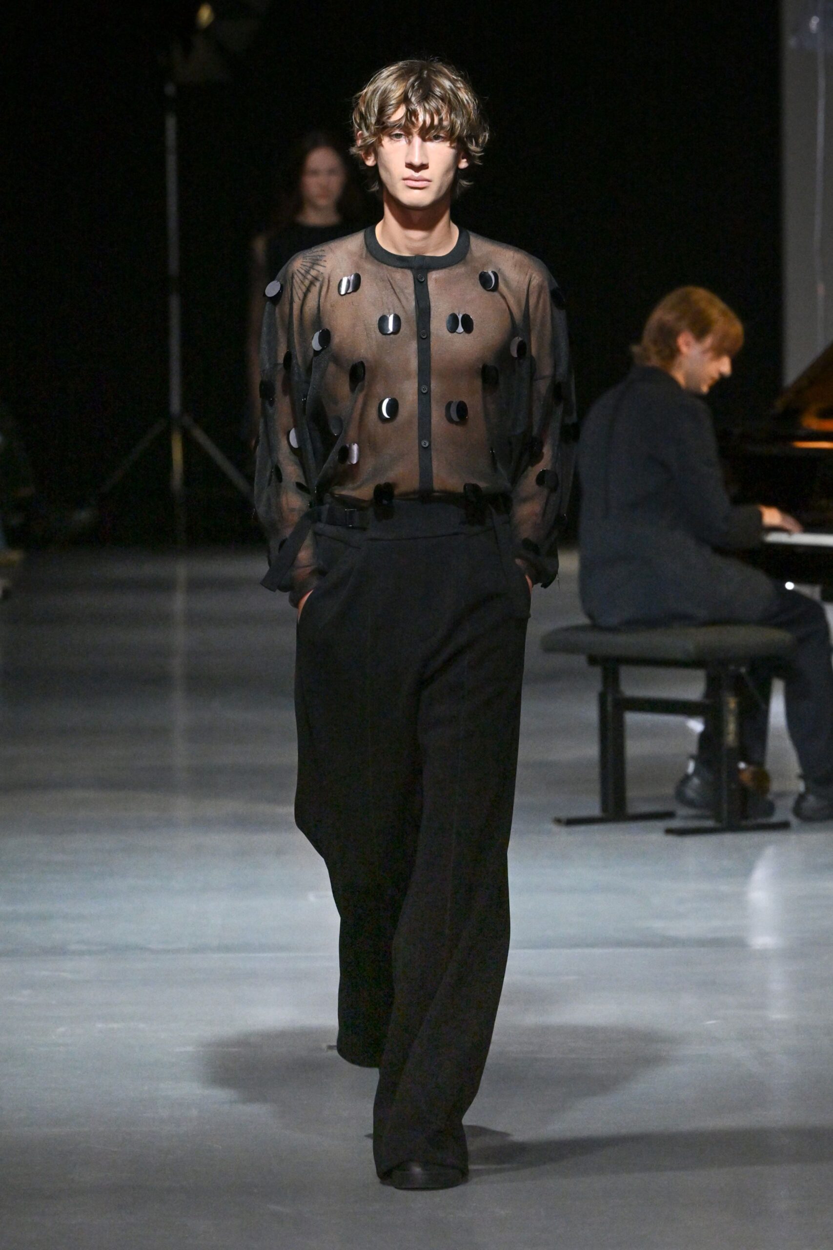 black sheer top and relaxed pants