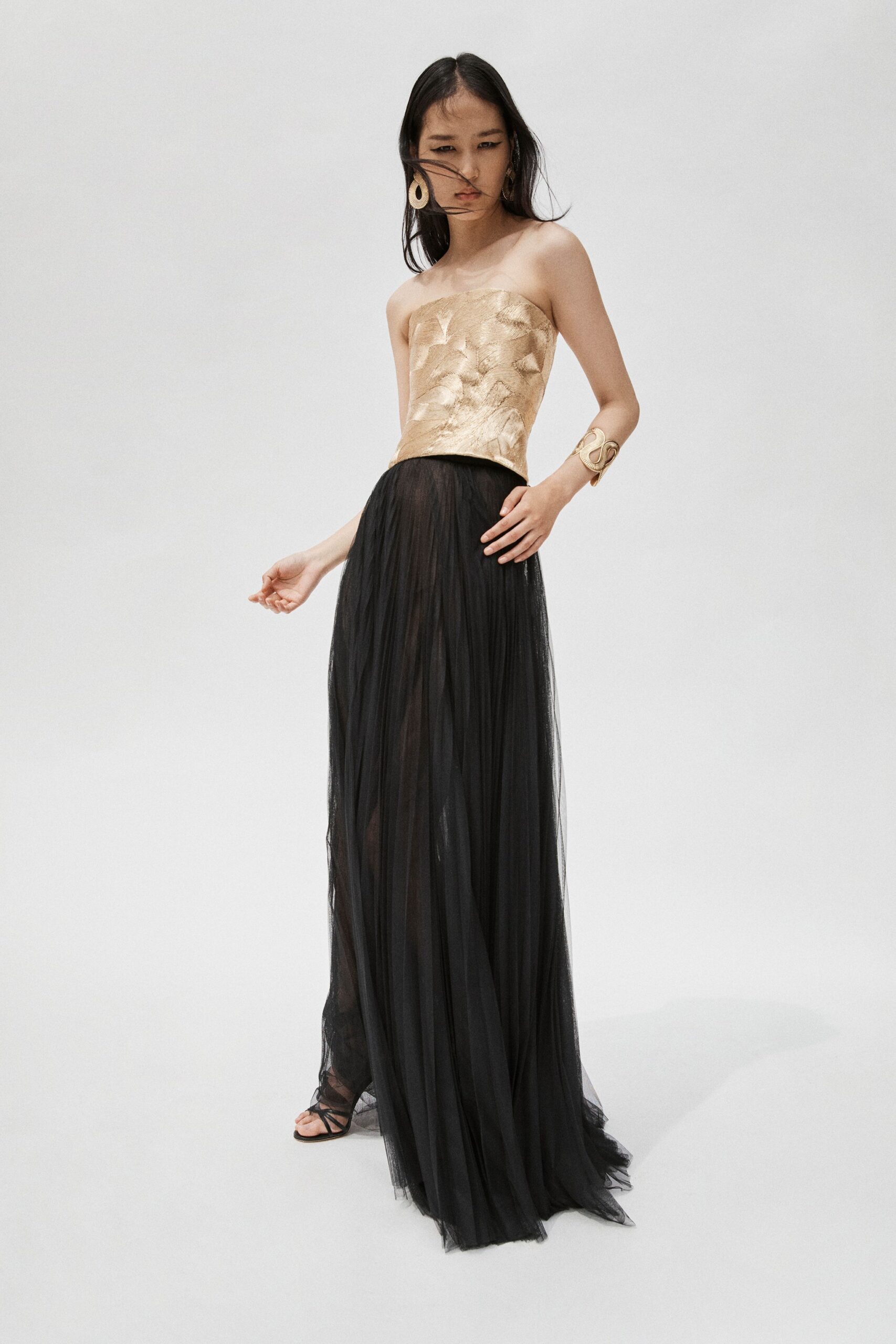 black tulle strapless fitted pleated layered sheer gown