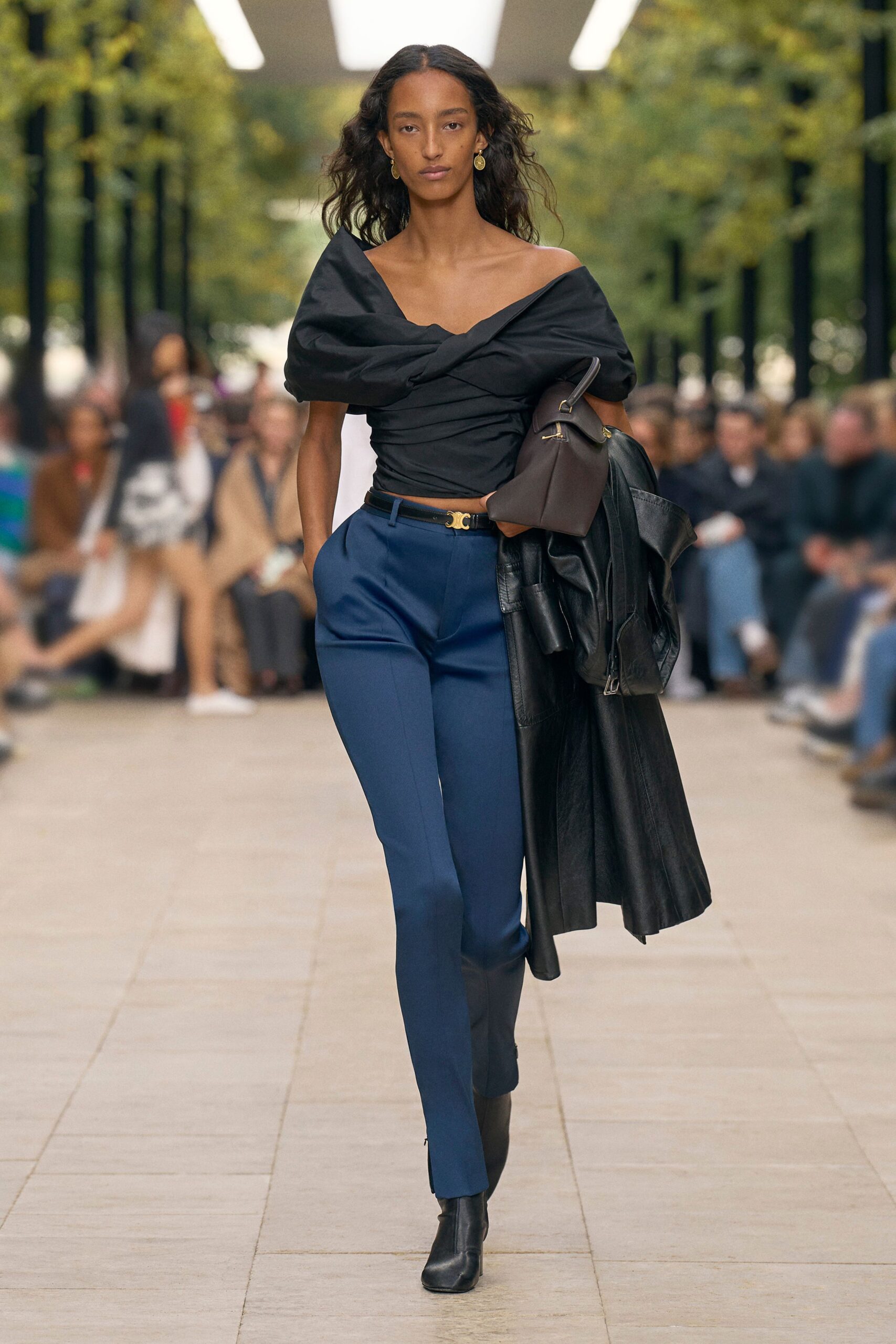 black fitted top with blue tailored pants