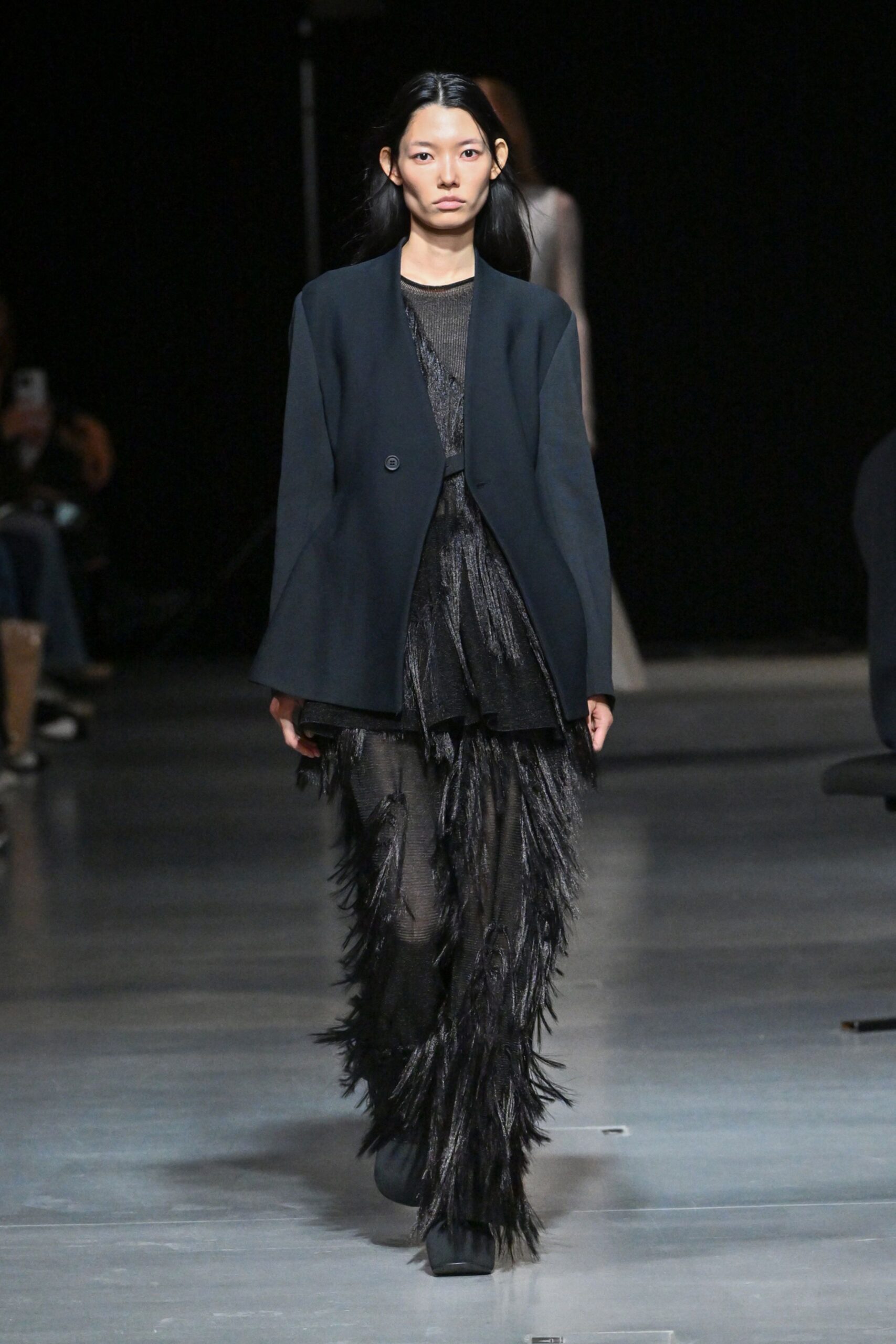 black blazer and fringed pants