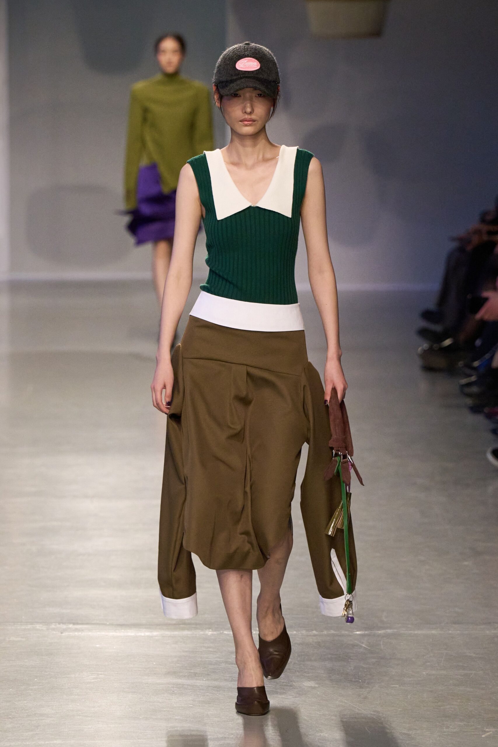 green fitted top with asymmetric brown skirt
