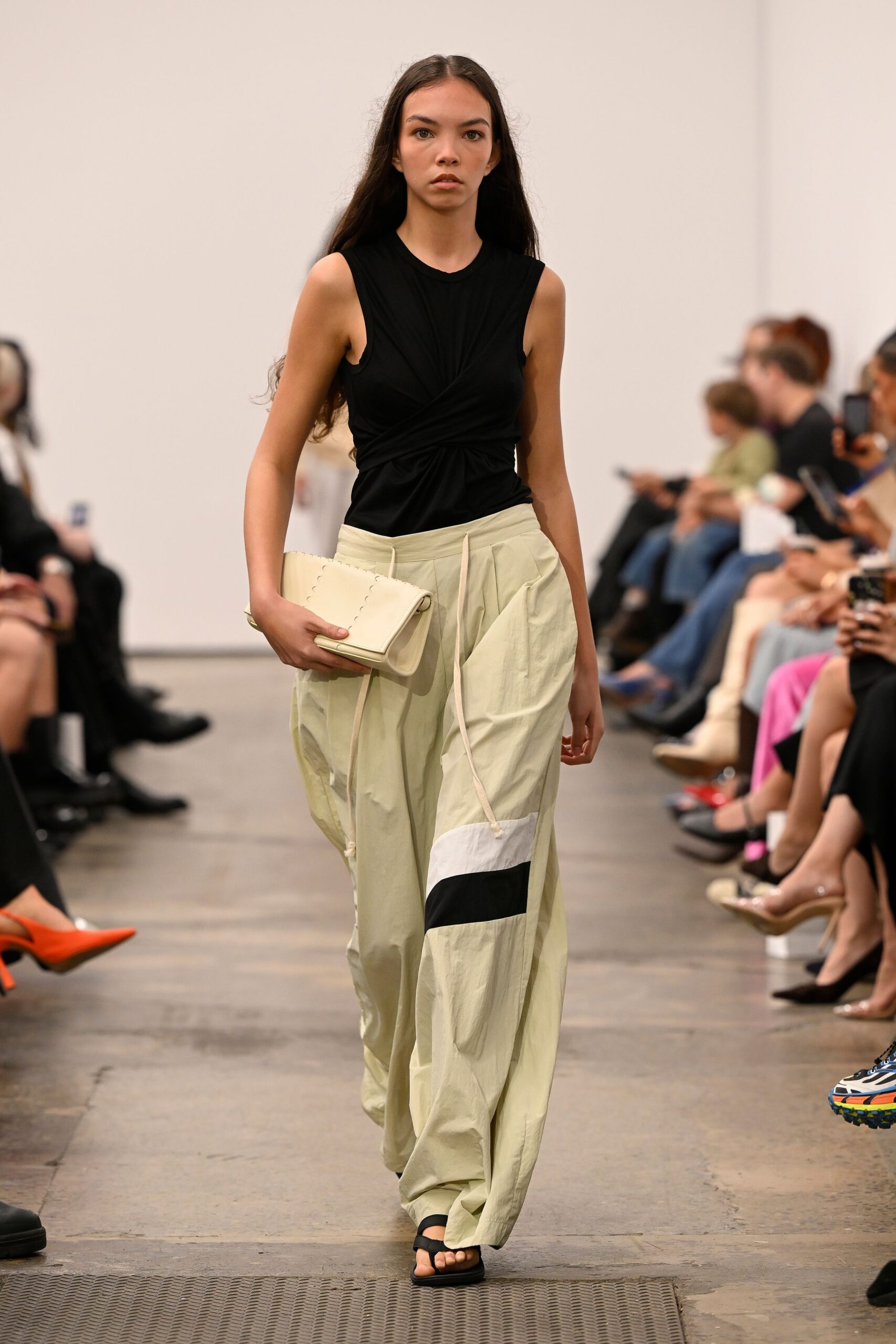 black fitted top beige relaxed pants
