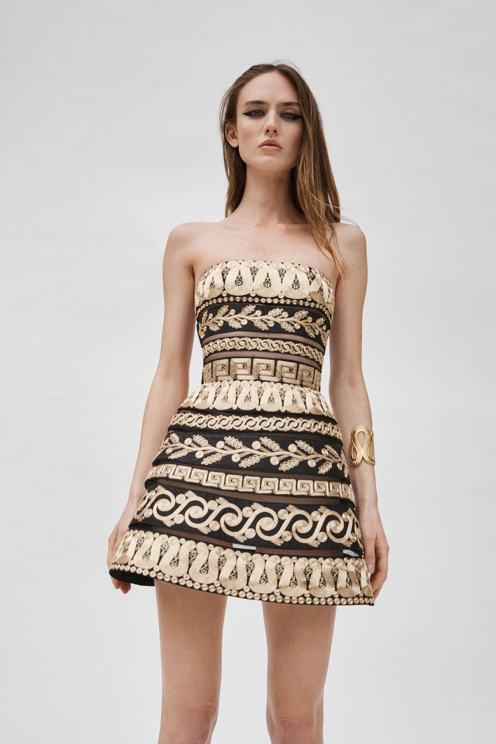 black and beige strapless mini-dress