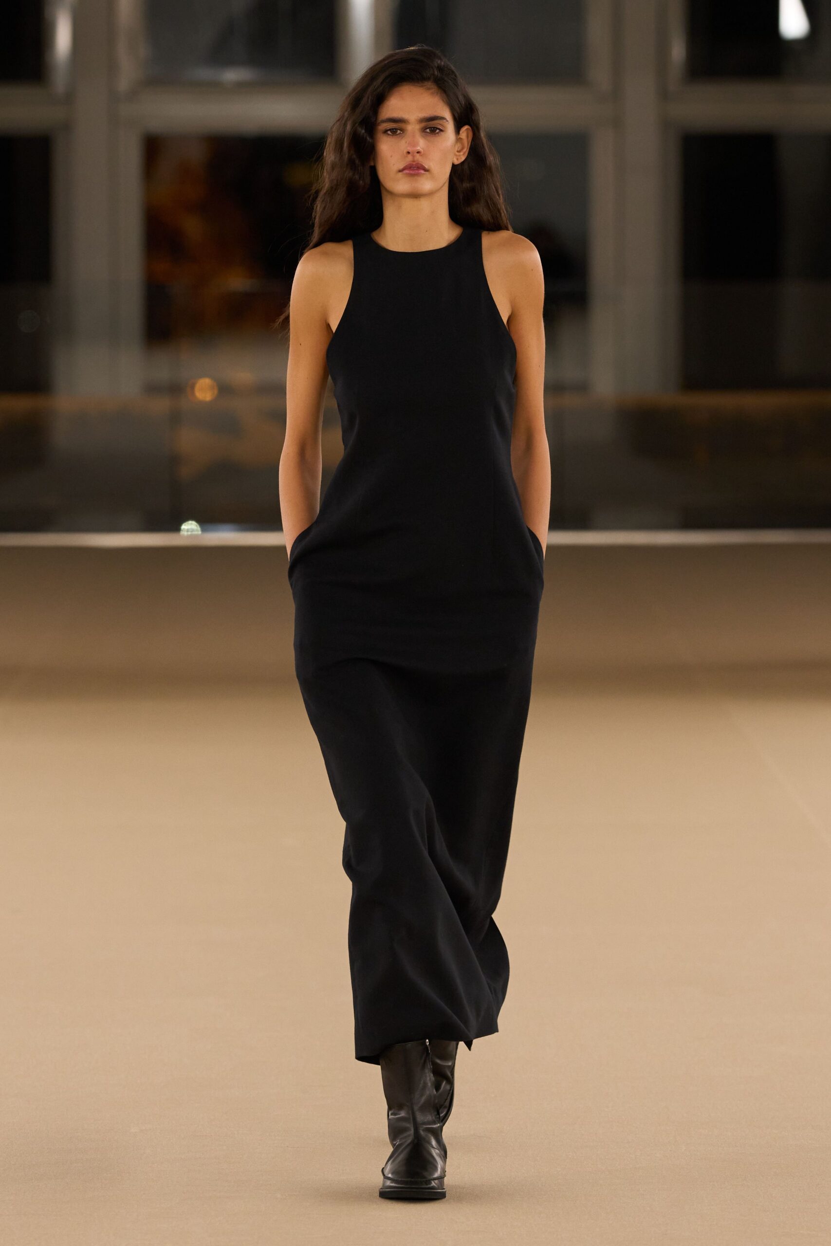 black sleeveless midi dress with boots