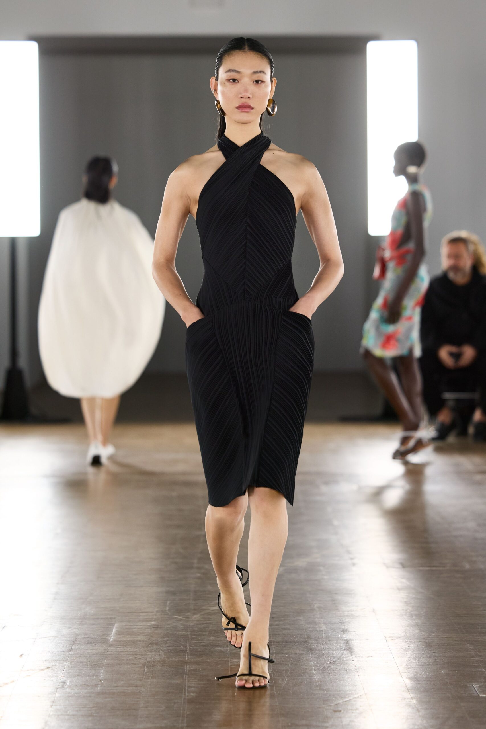 black fitted midi dress with strappy shoes
