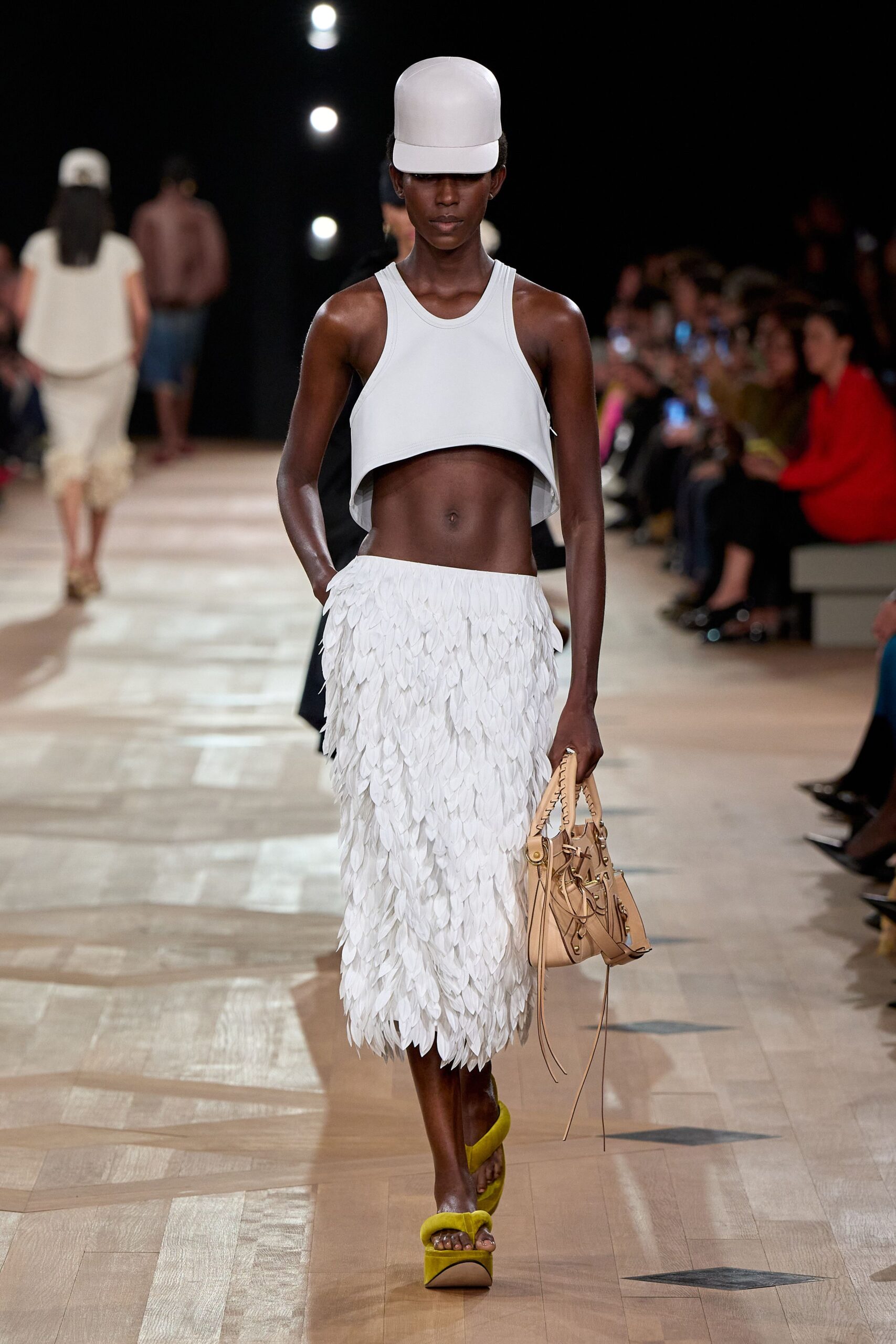 white crop-top and pleated skirt