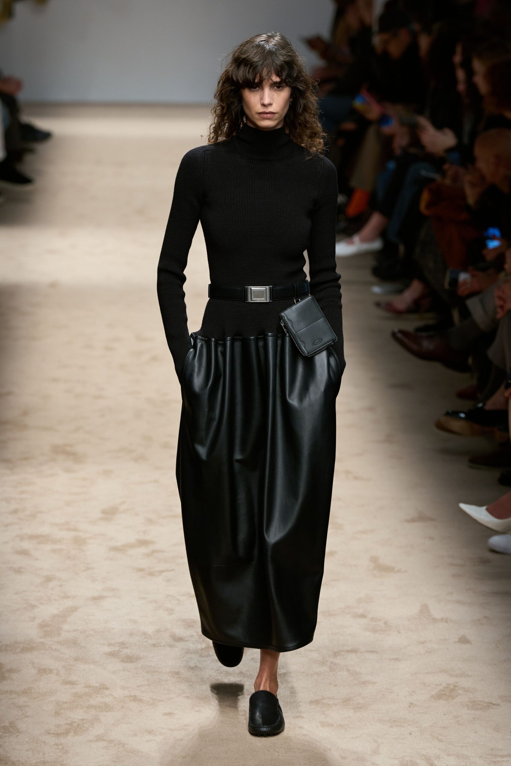 black fitted top and leather midi skirt
