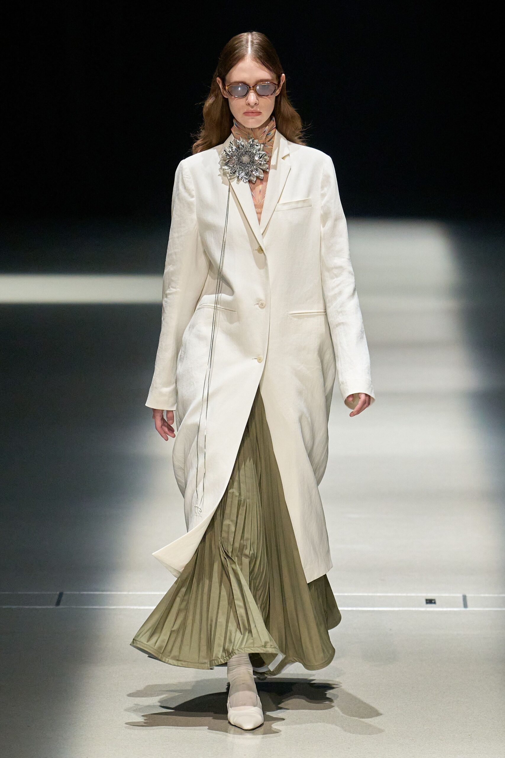 white coat green pleated skirt
