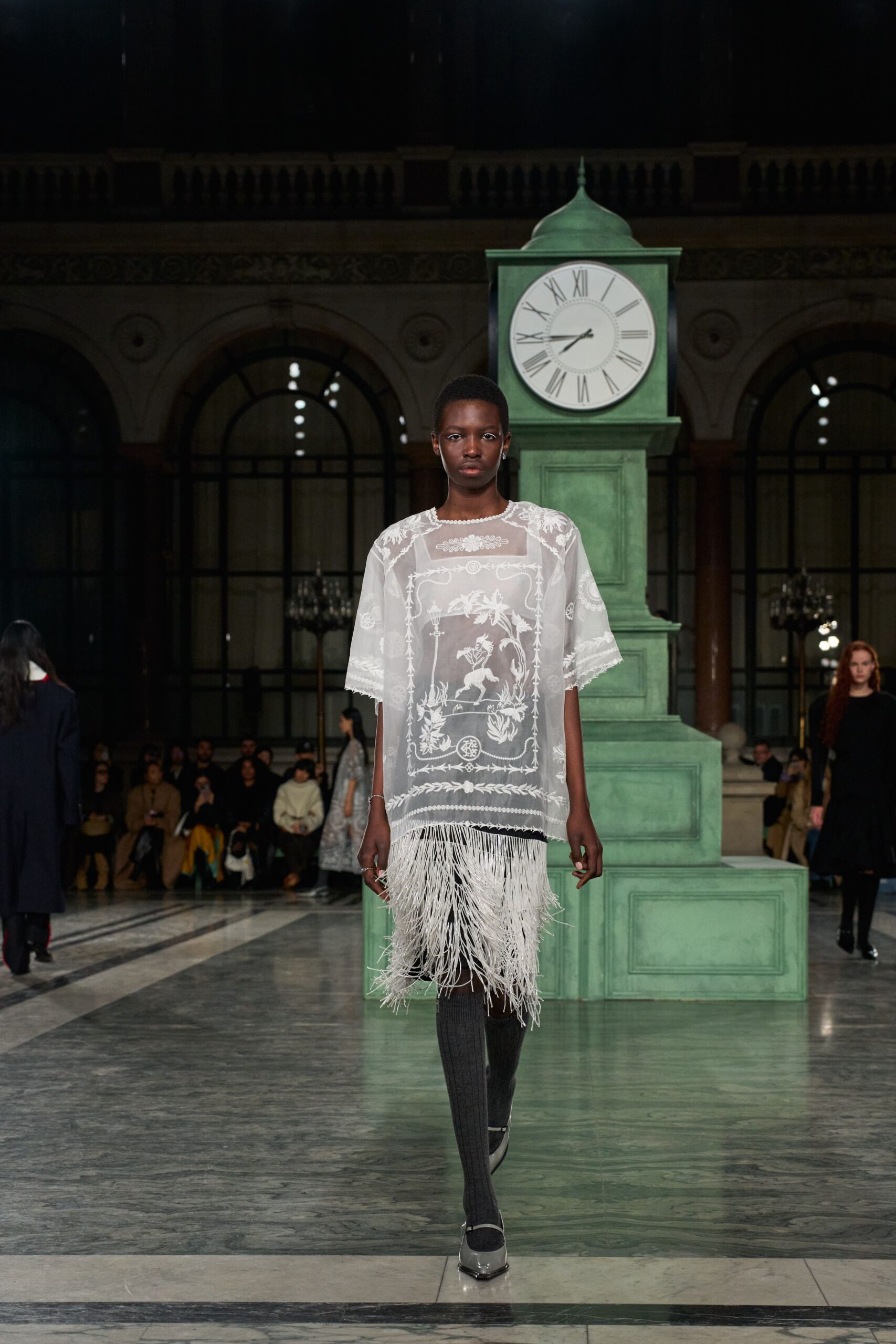 white embroidered top with fringes