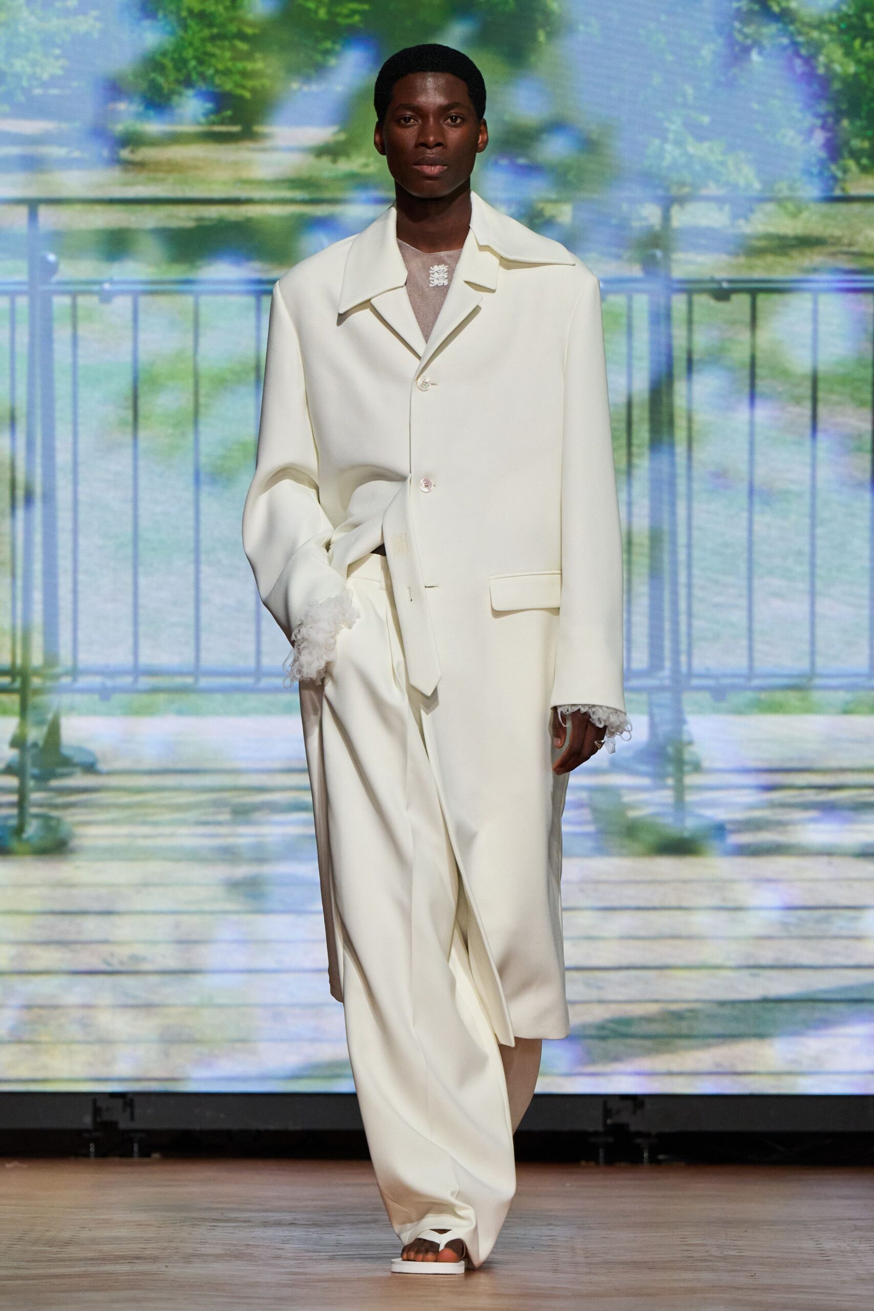 white cotton long-sleeve collared oversized buttoned coat
