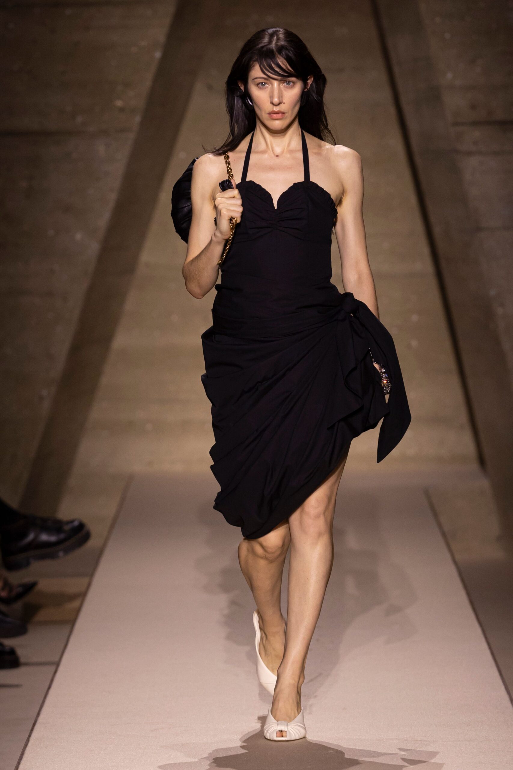 black mini halter dress with white shoes