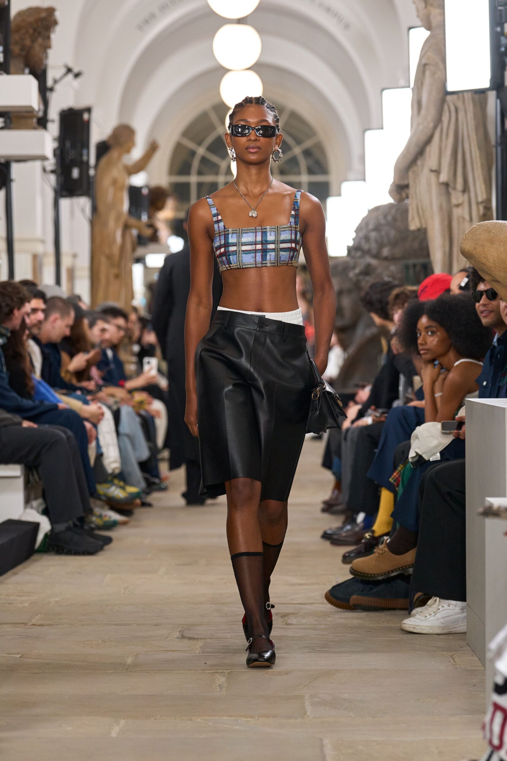 blue checked crop-top with black skirt