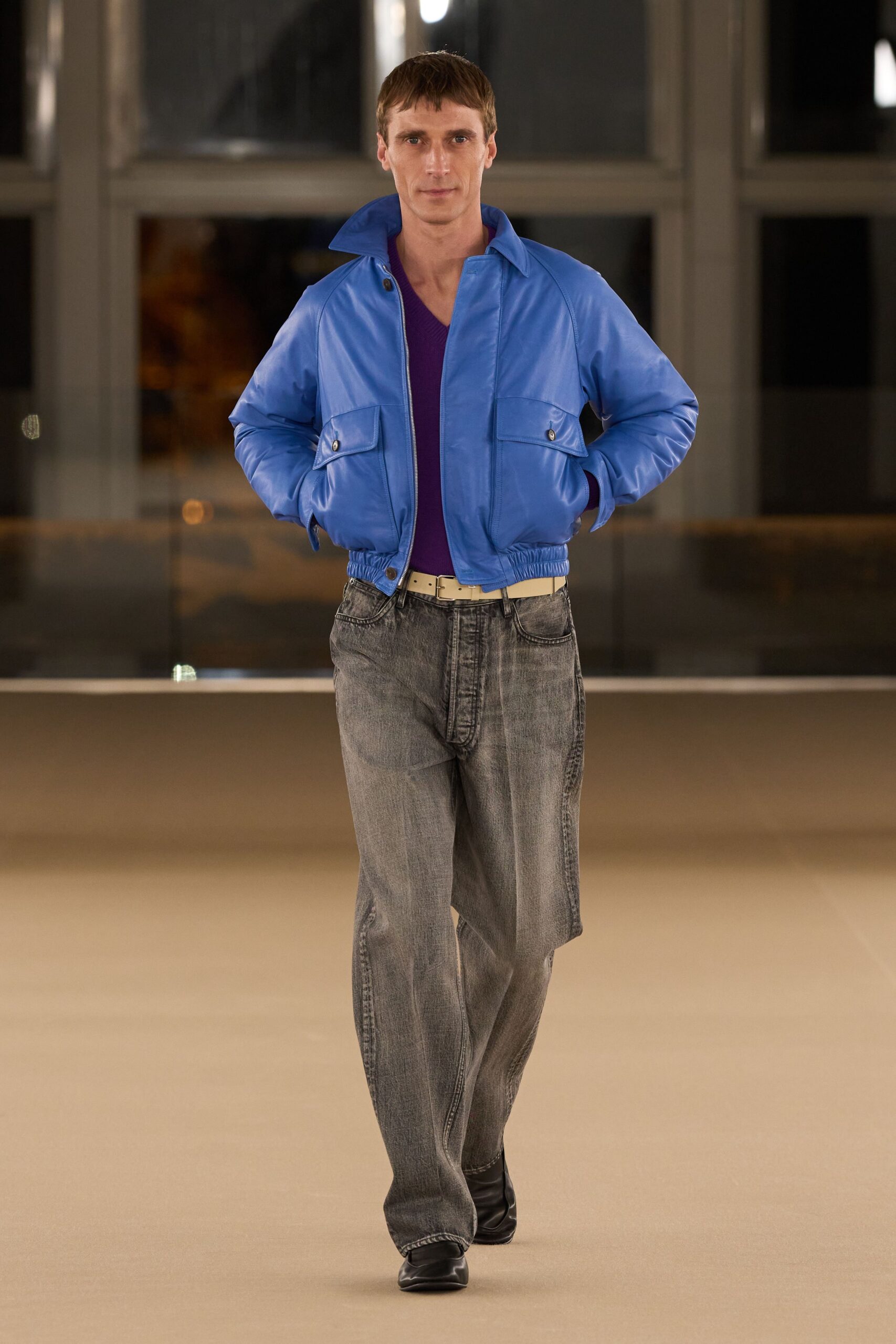 blue leather jacket with purple t-shirt