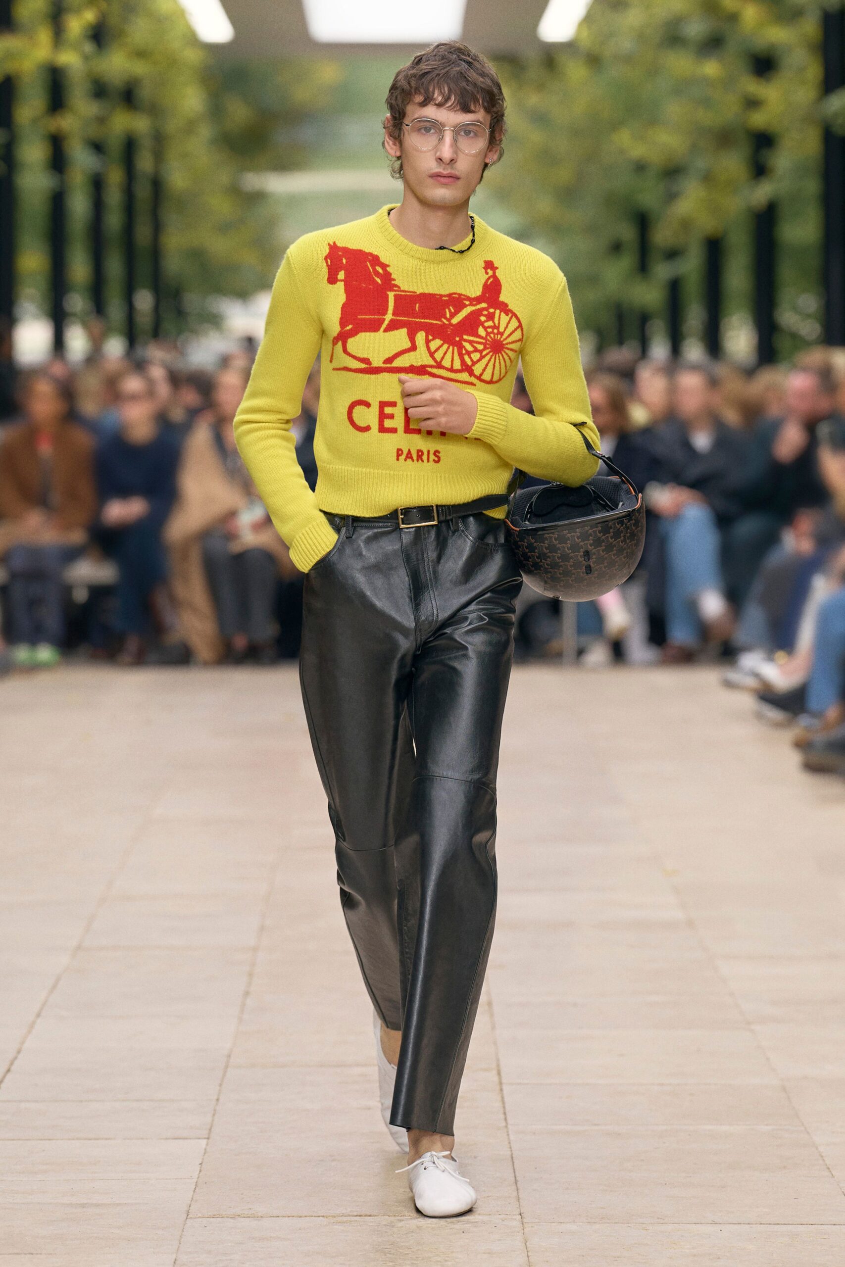 yellow printed sweater with black pants