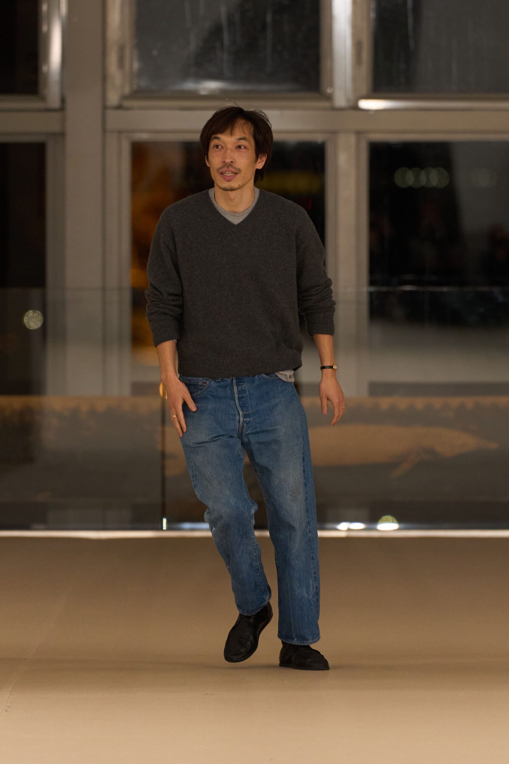 gray wool relaxed sweater with blue jeans