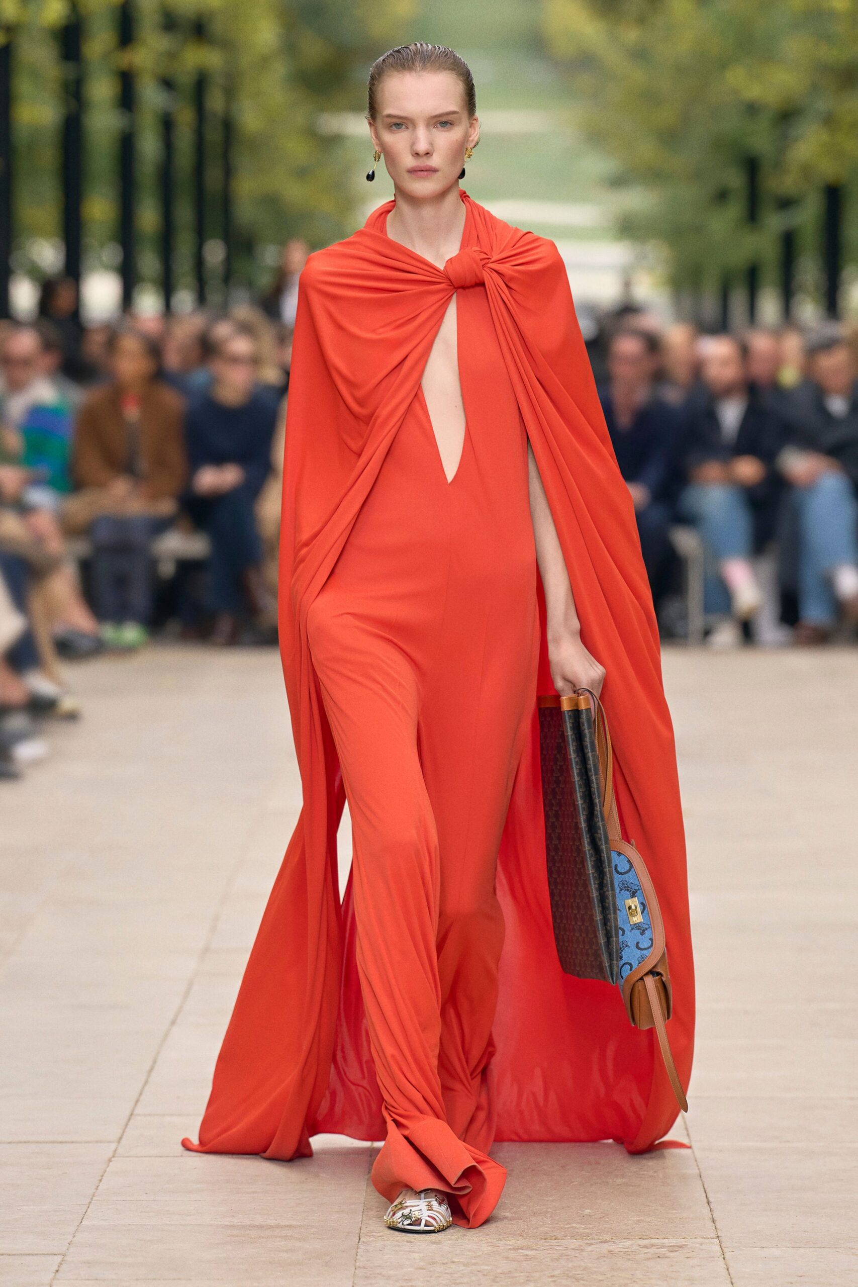orange silk jumpsuit with cape