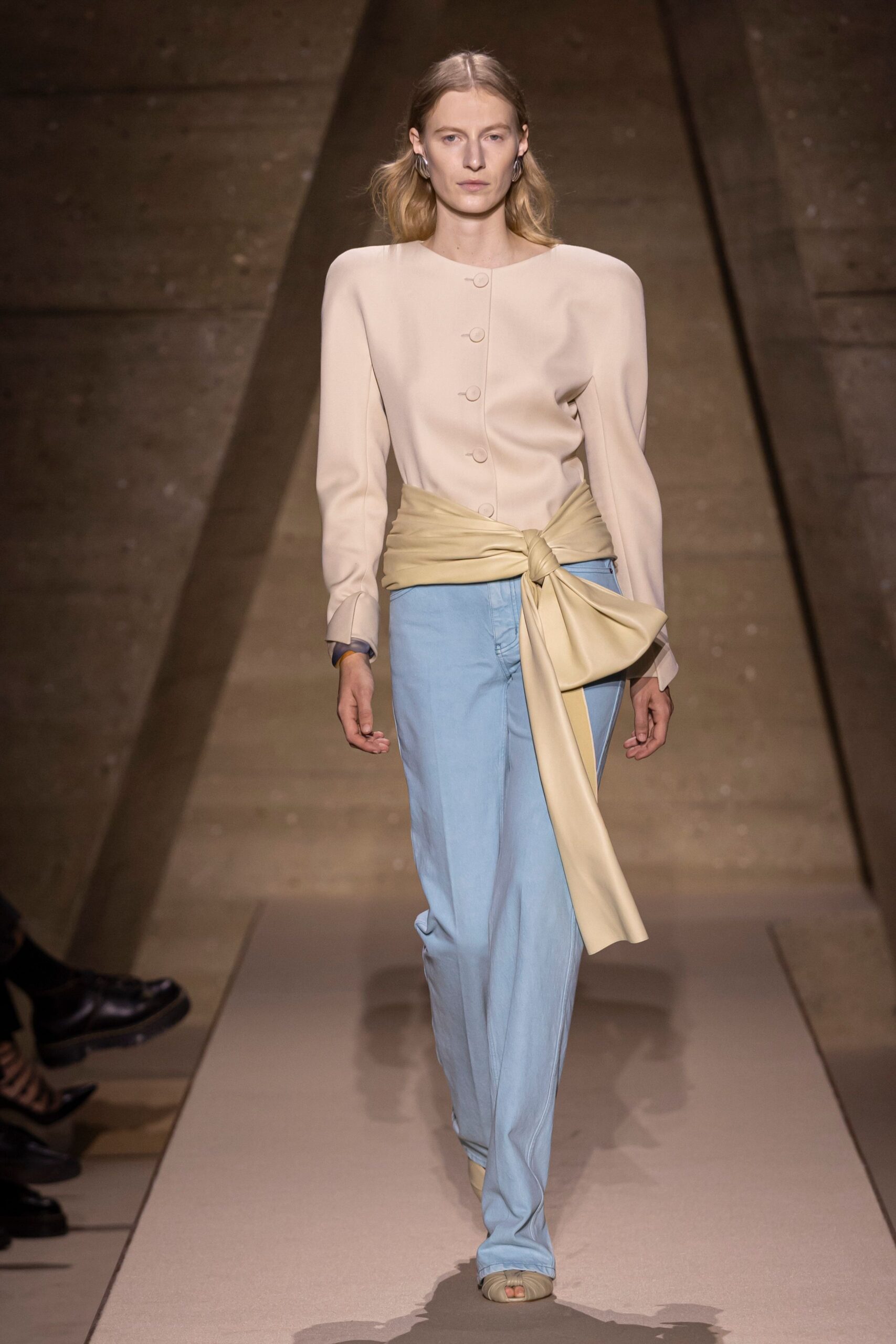 beige structured blazer with blue relaxed pants