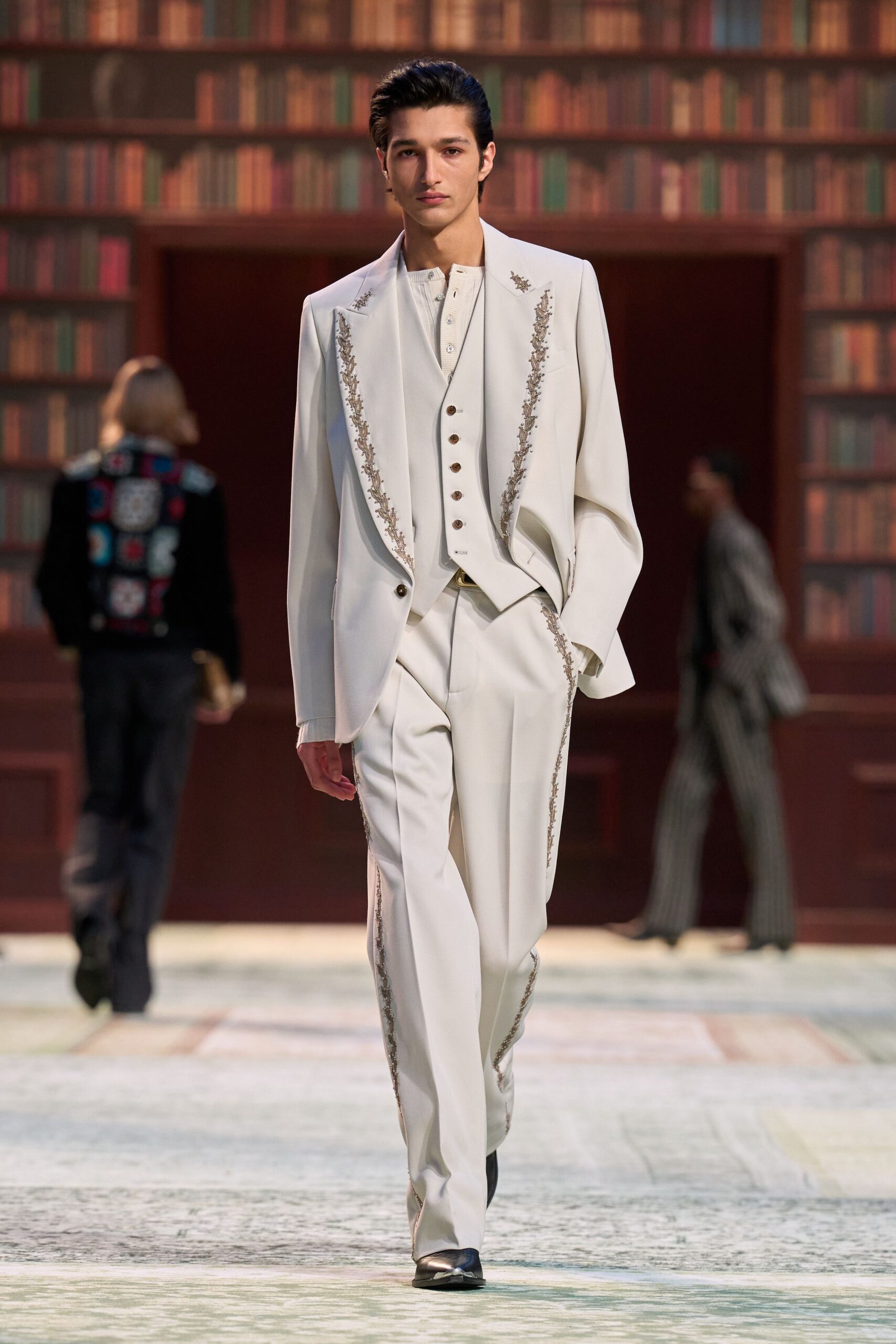 white tailored suit with black shoes