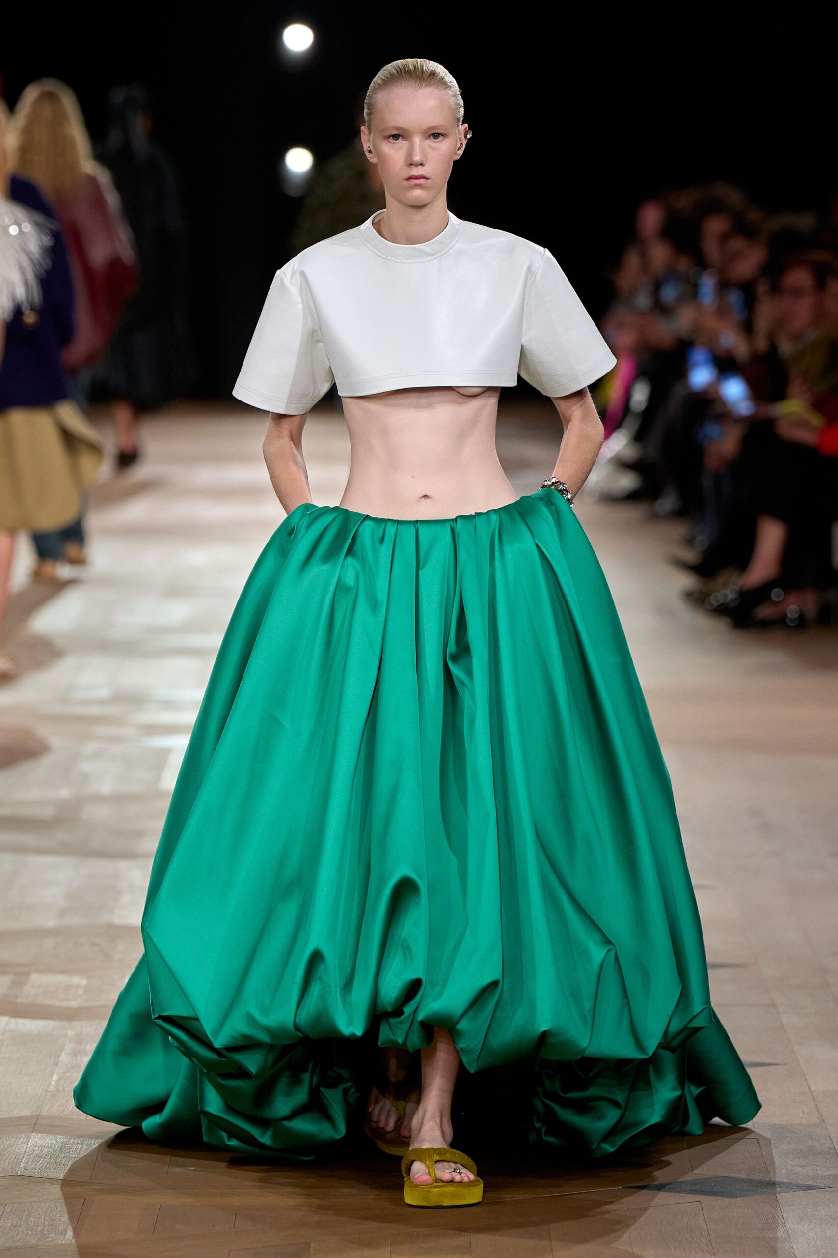 green silk fitted high-waisted pleated flowing maxi skirt