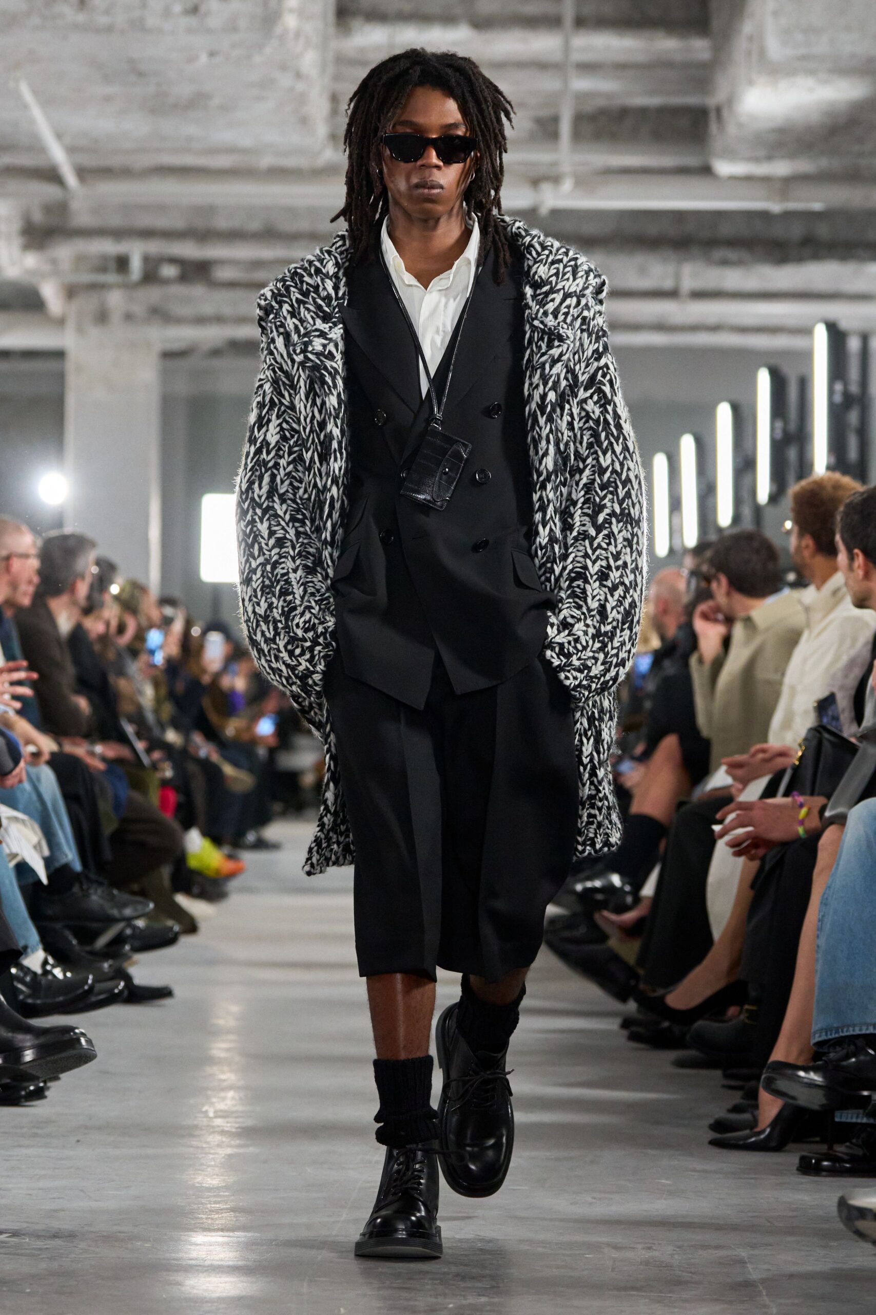 black and white wool coat with tailored suit