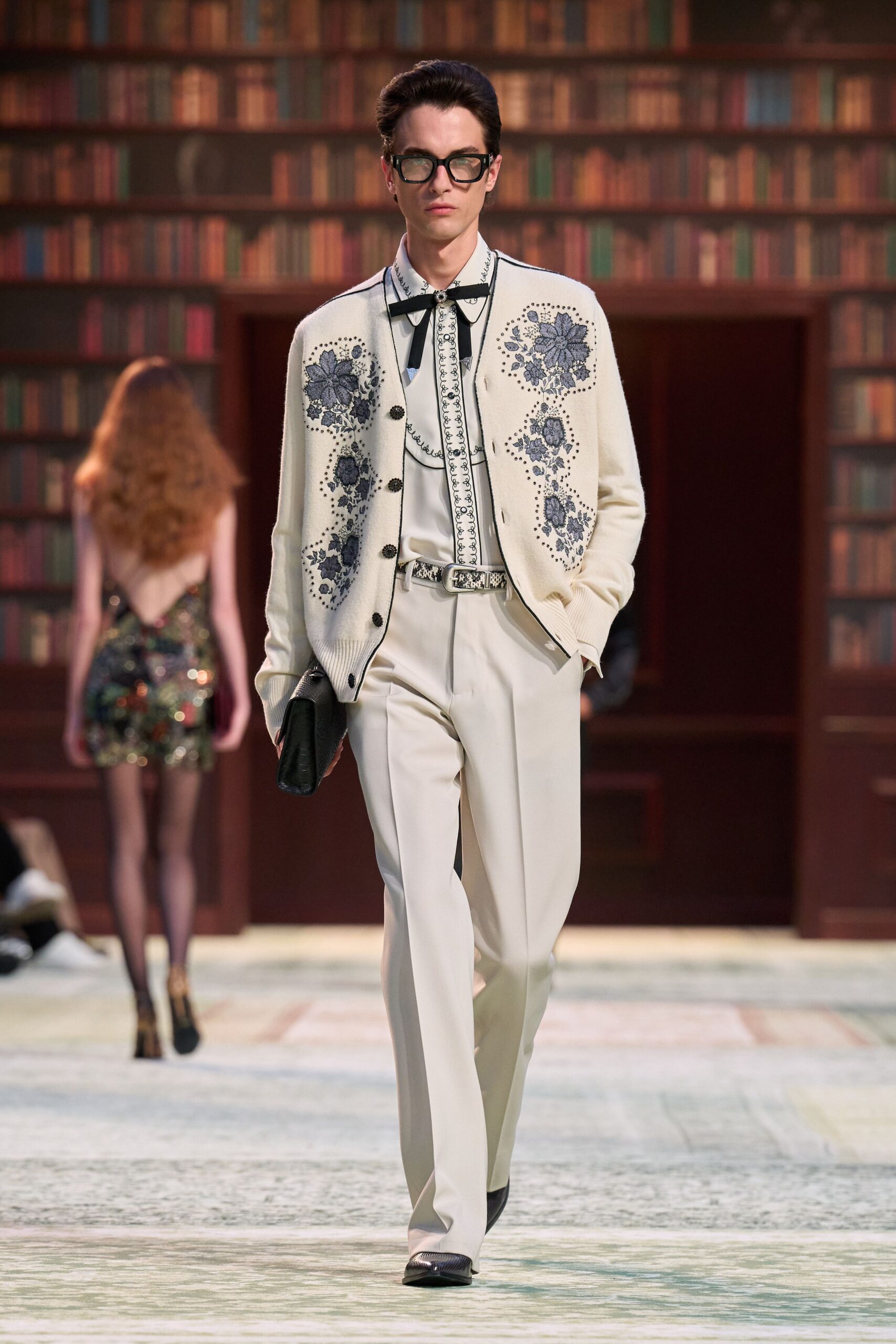 white embroidered cardigan with beige pants