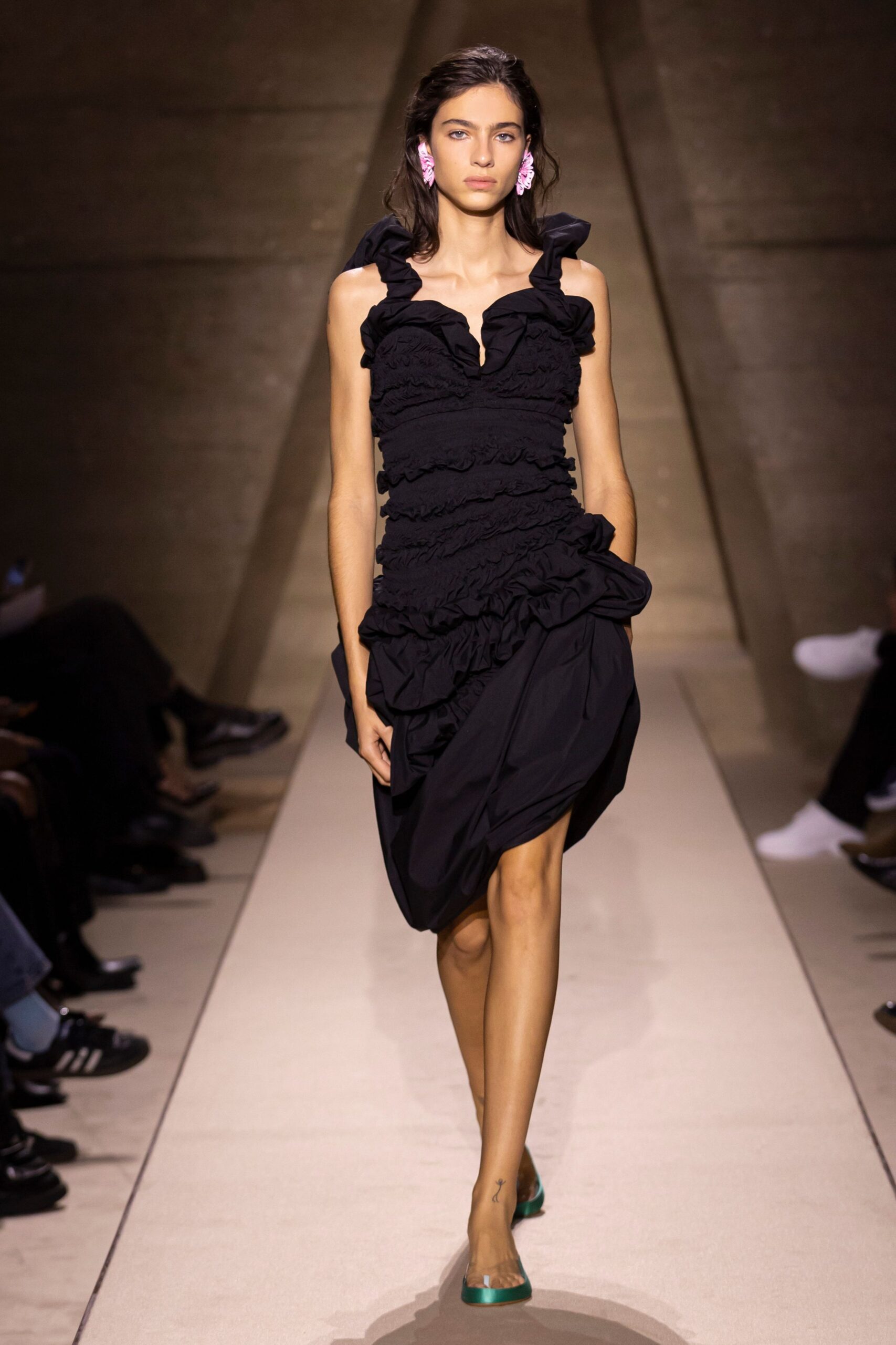 black ruffled mini dress with green shoes