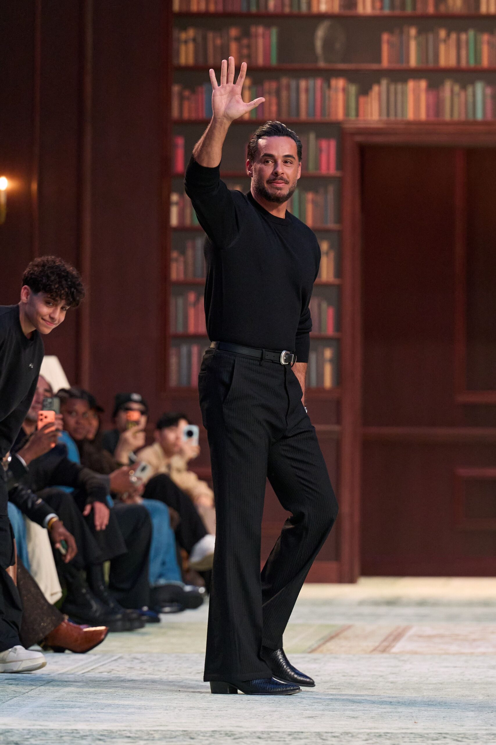 black fitted sweater and tailored pants