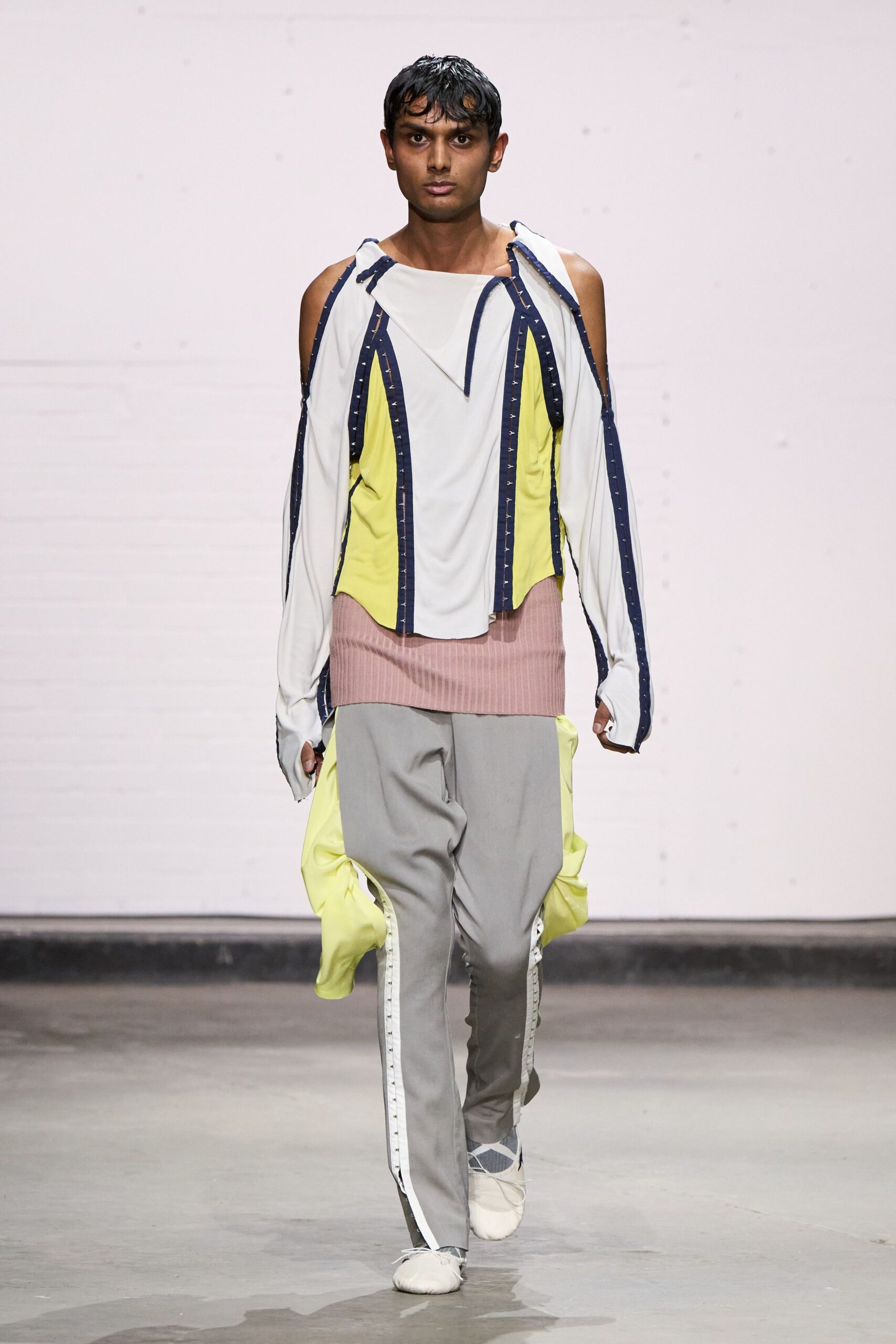 relaxed white top with gray pants