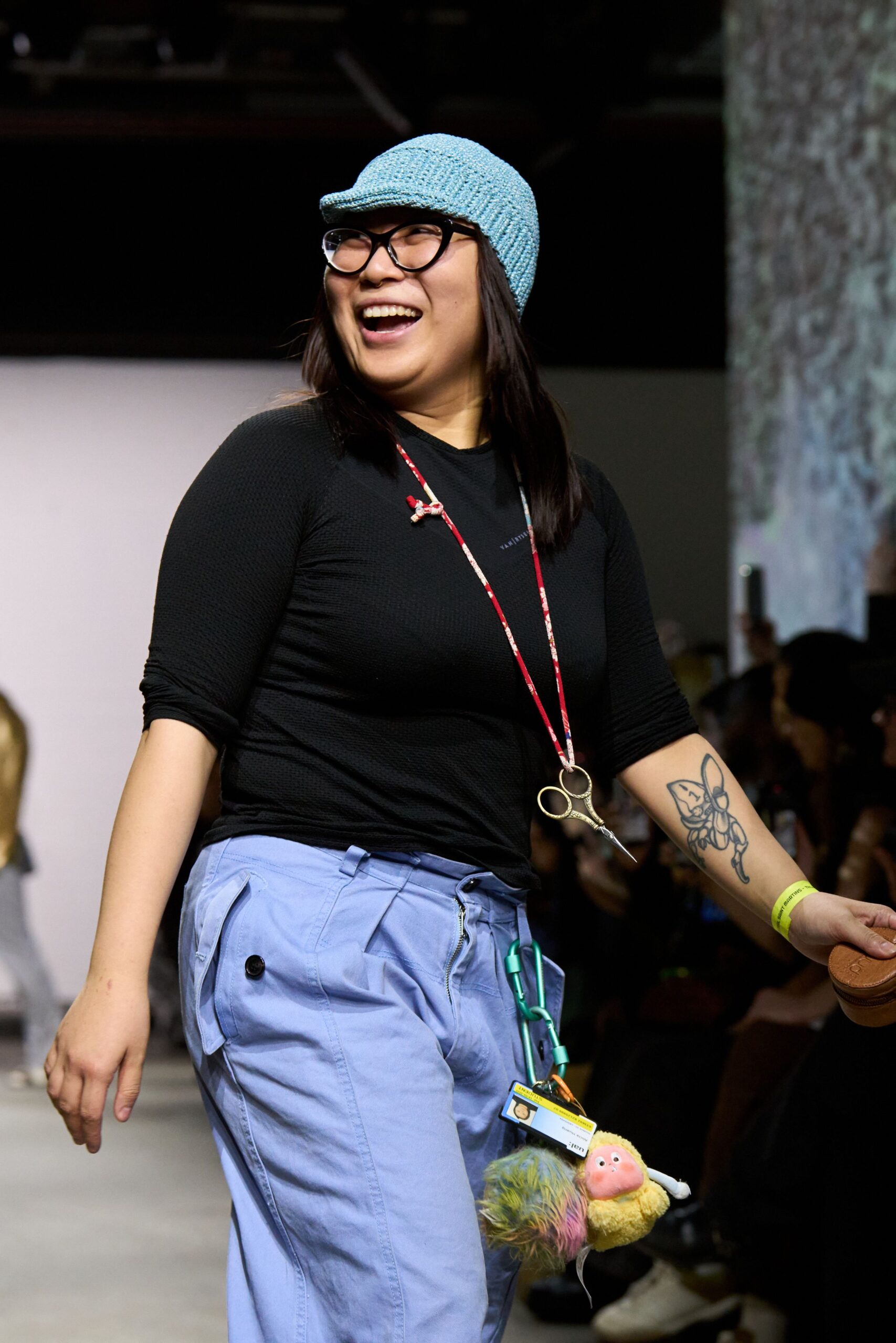 black fitted top with blue pants