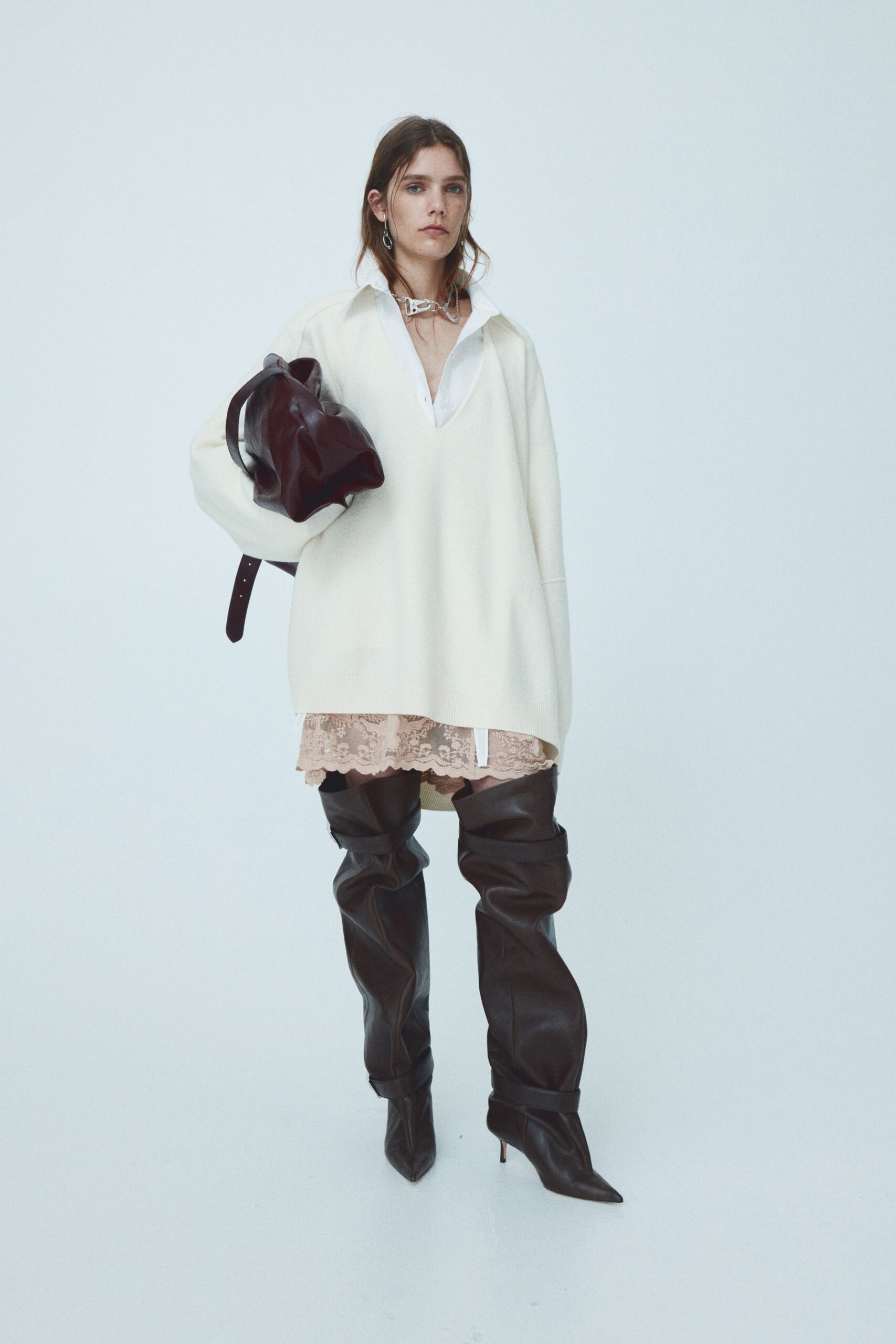 oversized white sweater with lace dress
