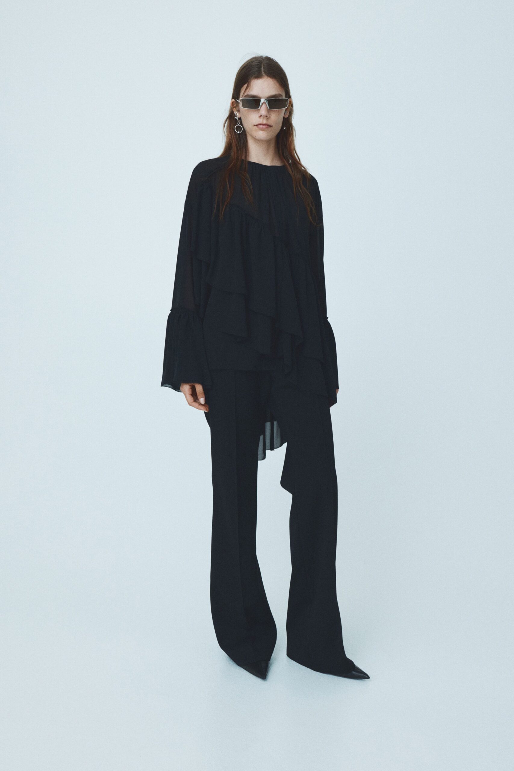 black layered top with fitted pants