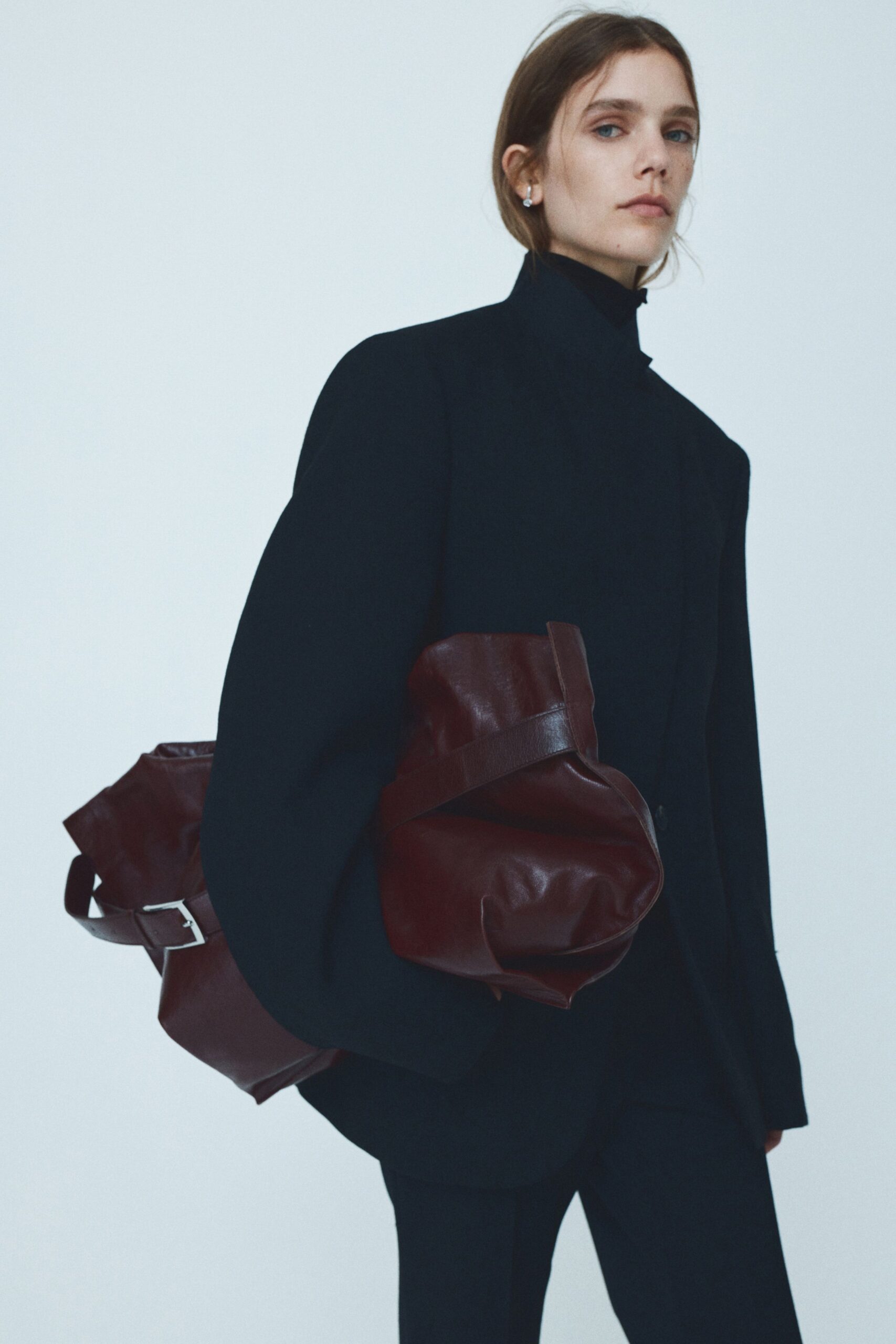 black oversized blazer with brown bag