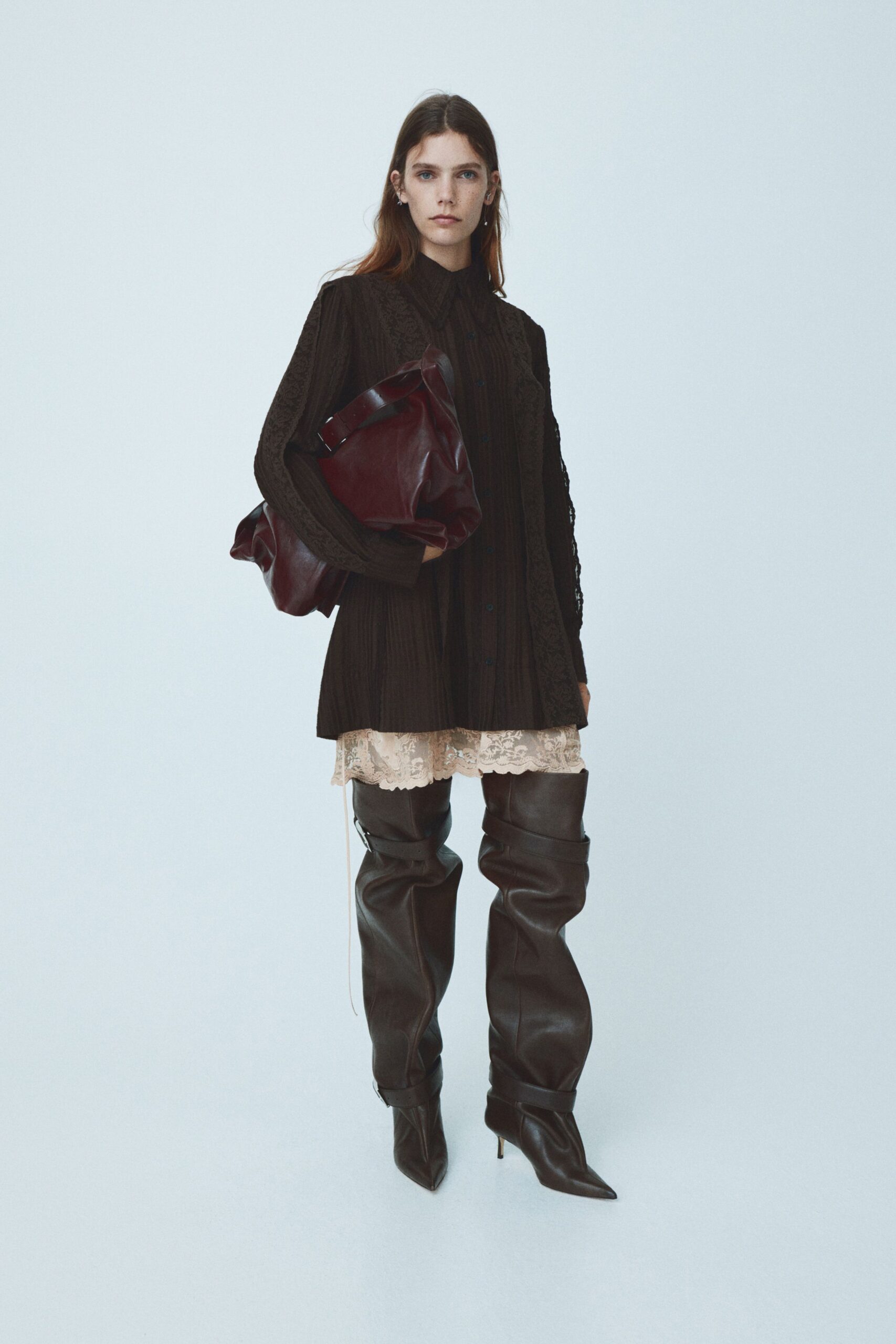 black mini dress with brown boots