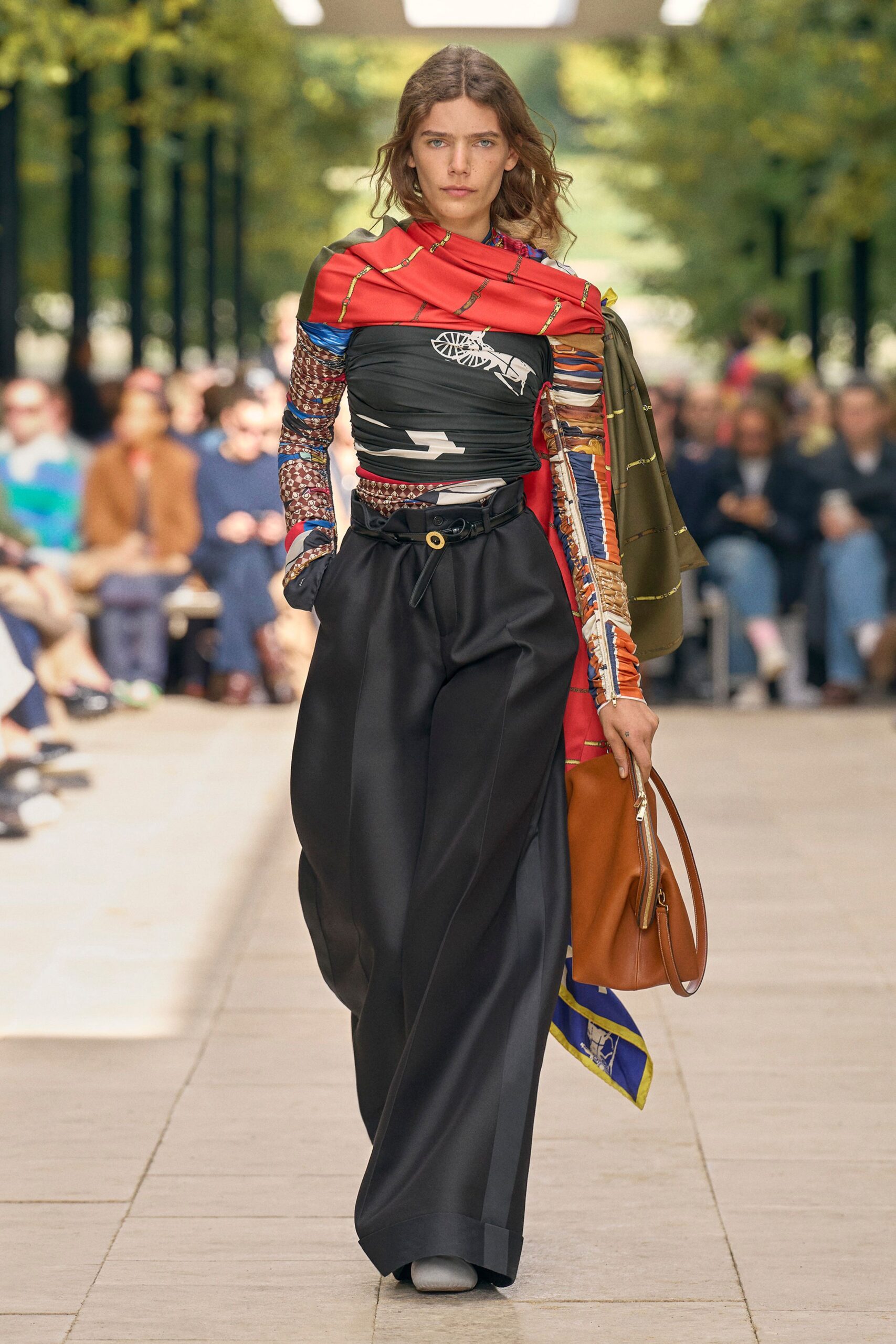 black multi-layered top with wide-leg pants