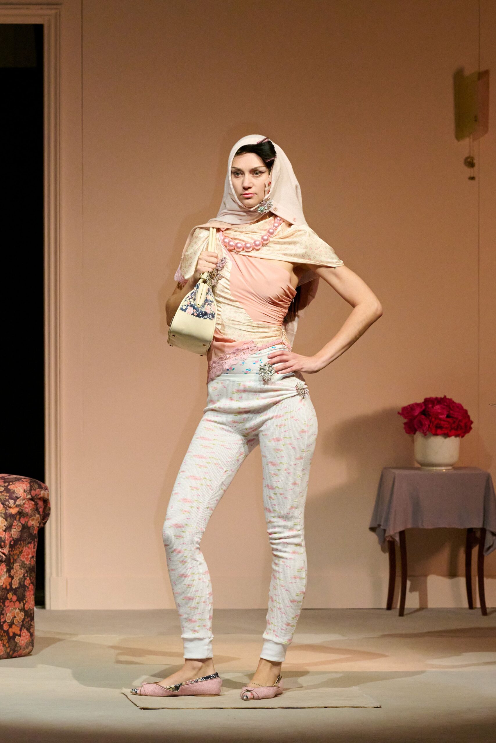 pink fitted top with white pants