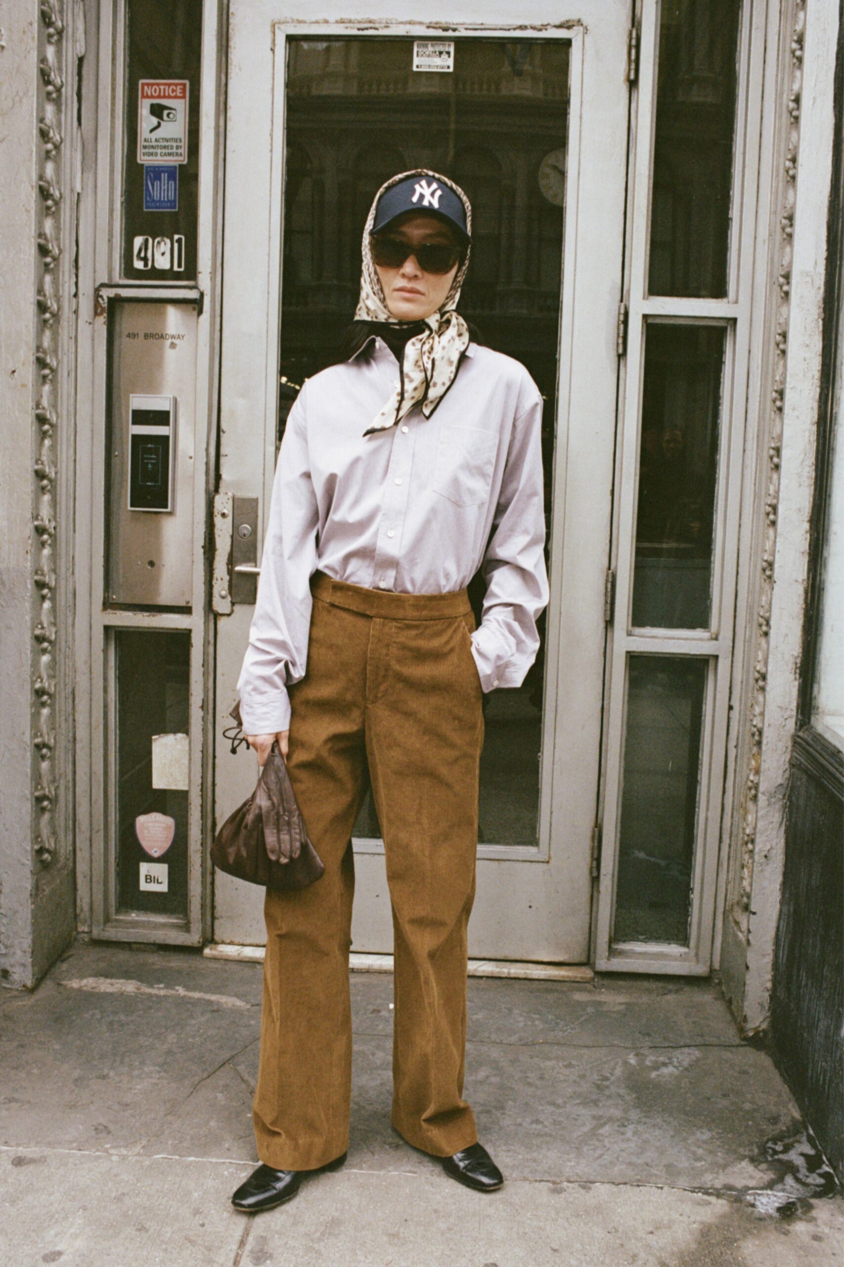 white shirt brown pants accessories