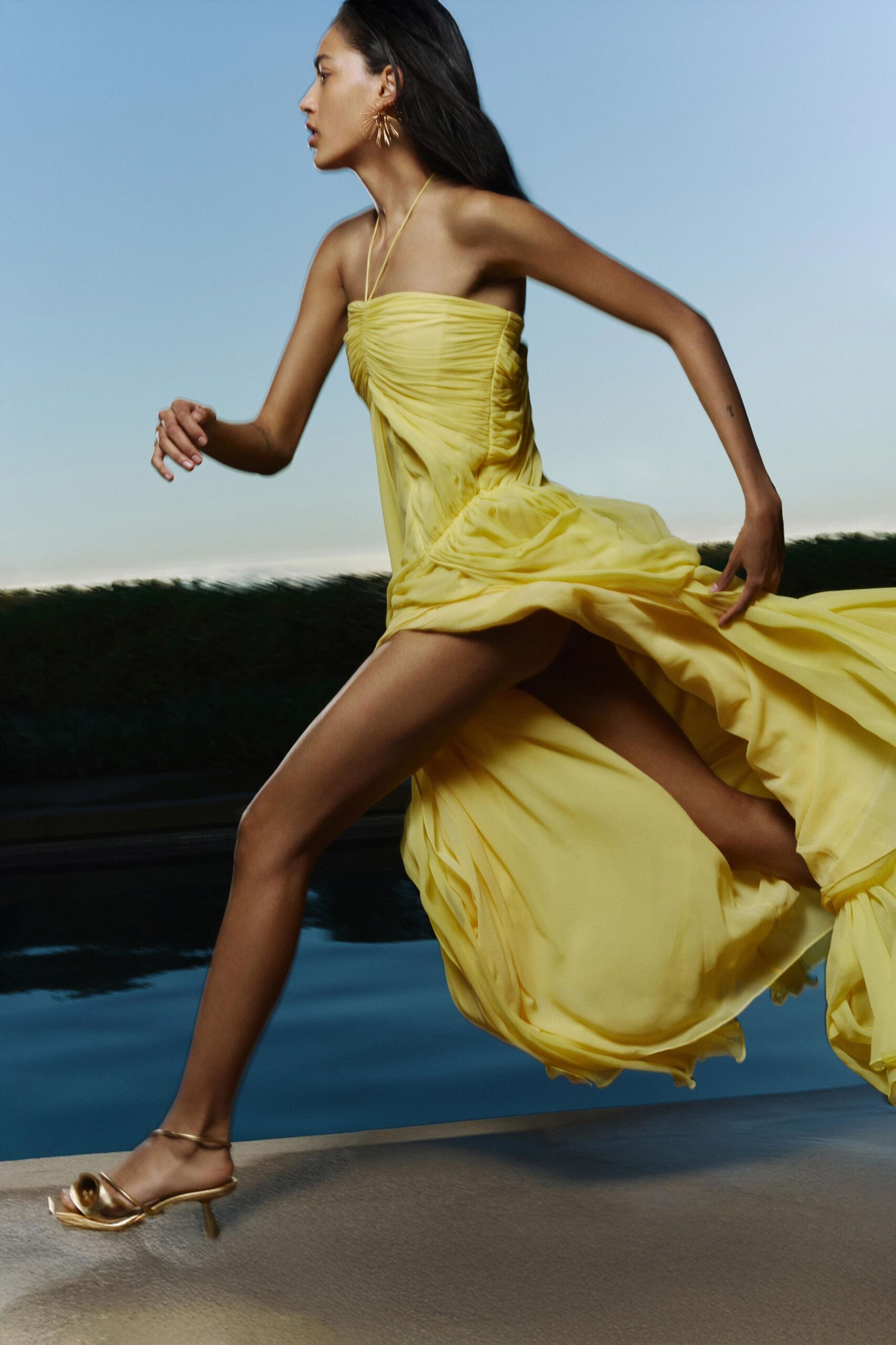 yellow silk strapless fitted ruched flowing maxi gown